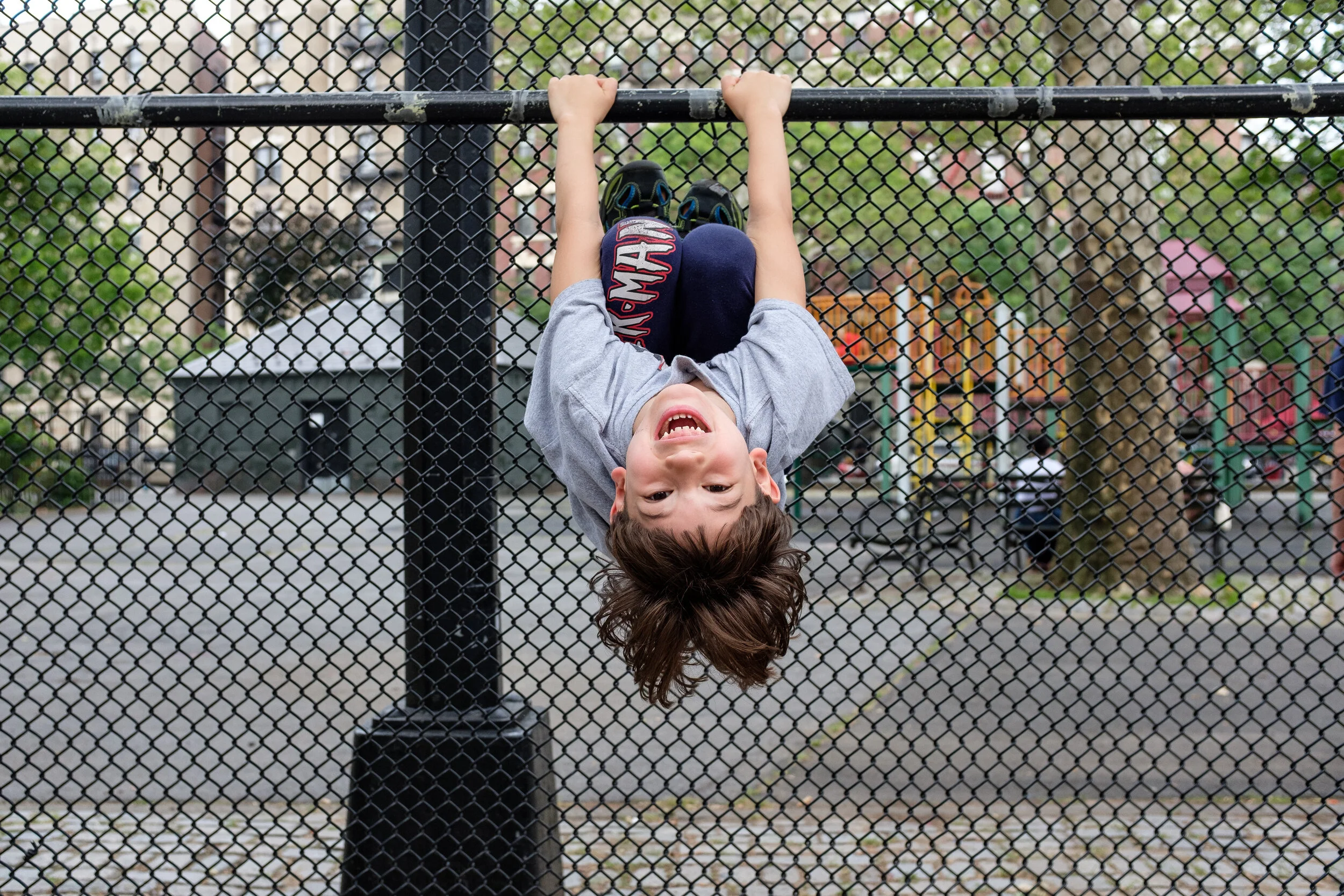 Young boy upside-down in New York City Park | 2019