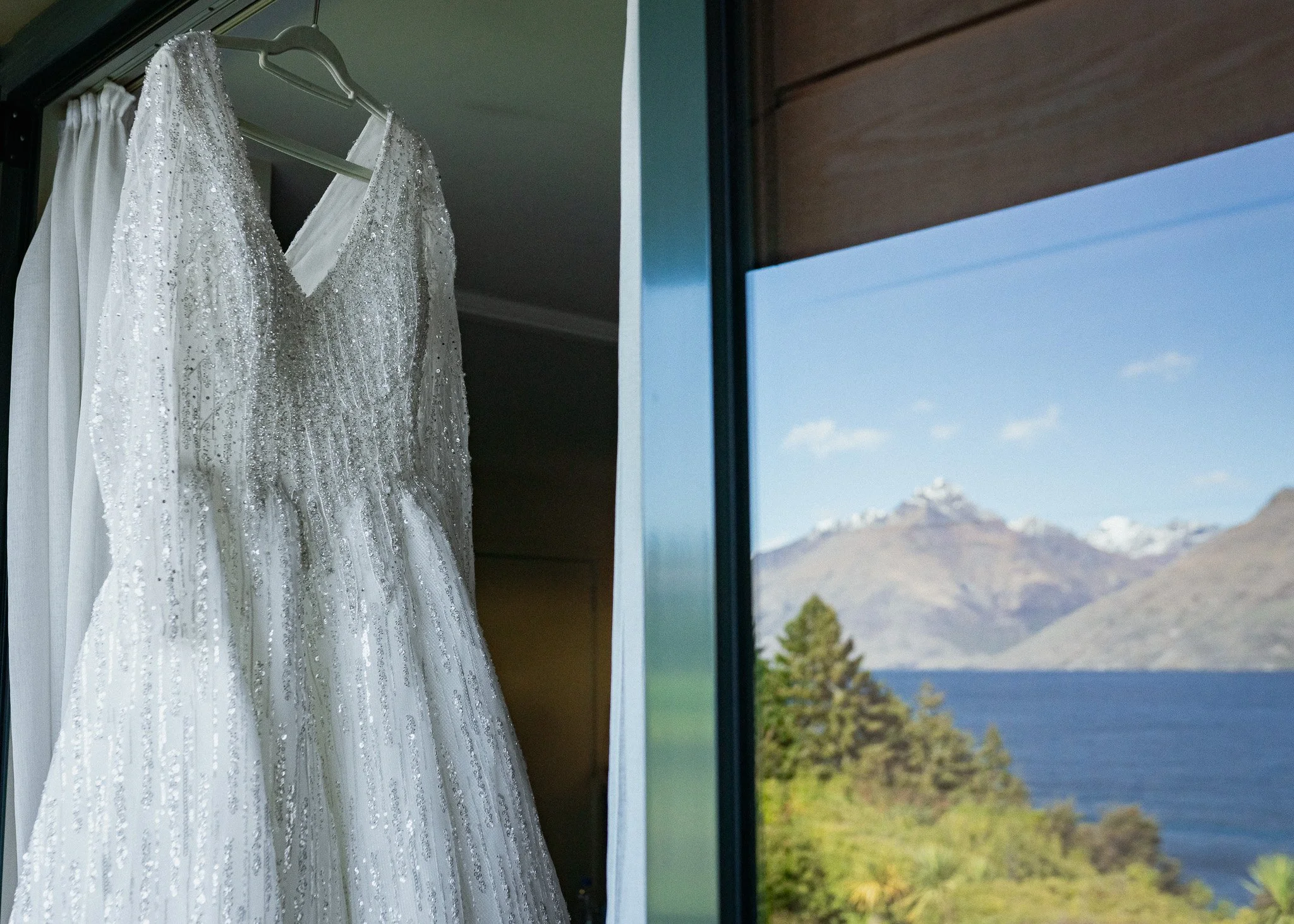    Queenstown winter wedding couple    Snowy wedding portraits Queenstown    Queenstown wedding photographer winter    First look winter wedding Queenstown    Queenstown lakefront bridal party photos    Intimate wedding ceremony Queenstown    Winter 