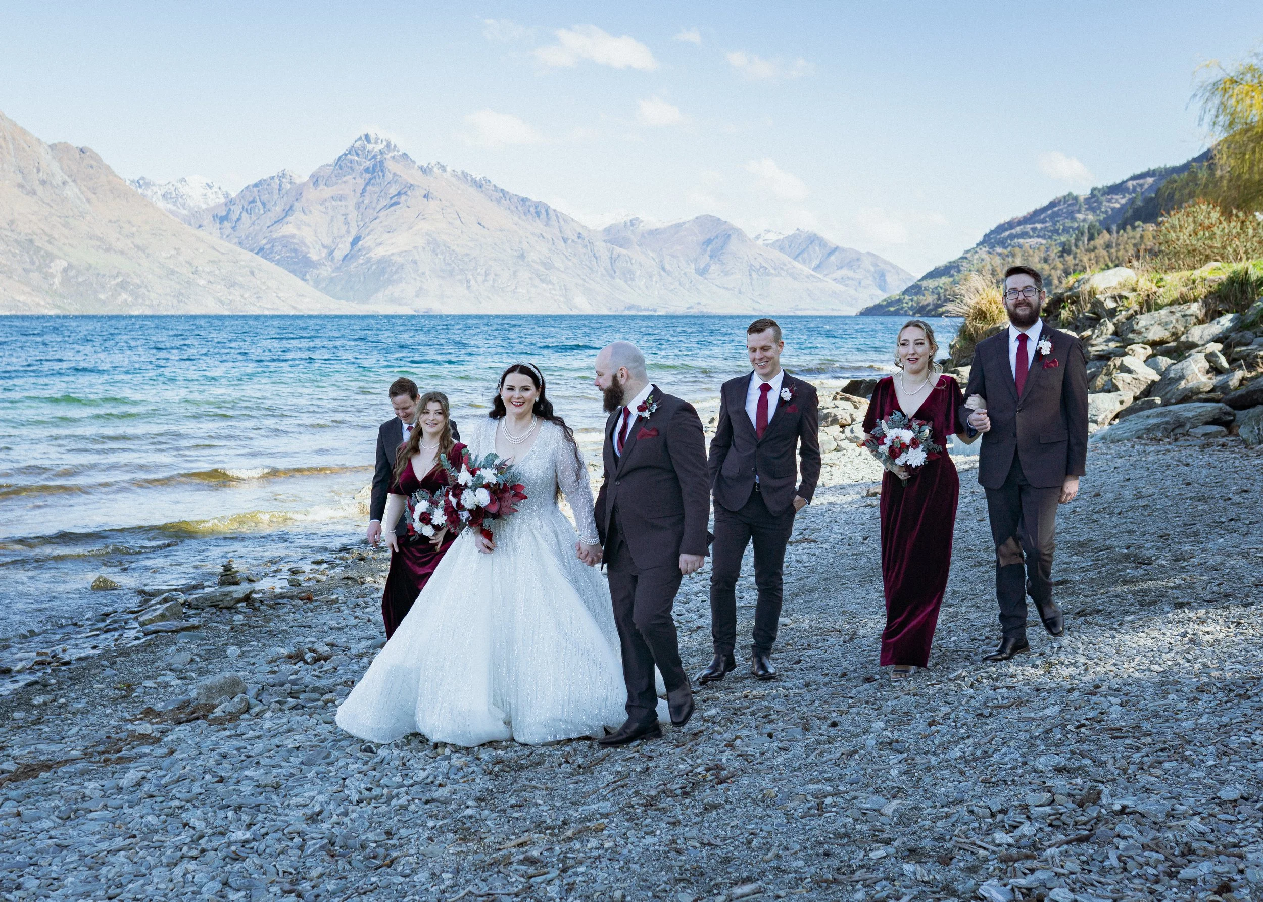    Queenstown winter wedding couple    Snowy wedding portraits Queenstown    Queenstown wedding photographer winter    First look winter wedding Queenstown    Queenstown lakefront bridal party photos    Intimate wedding ceremony Queenstown    Winter 