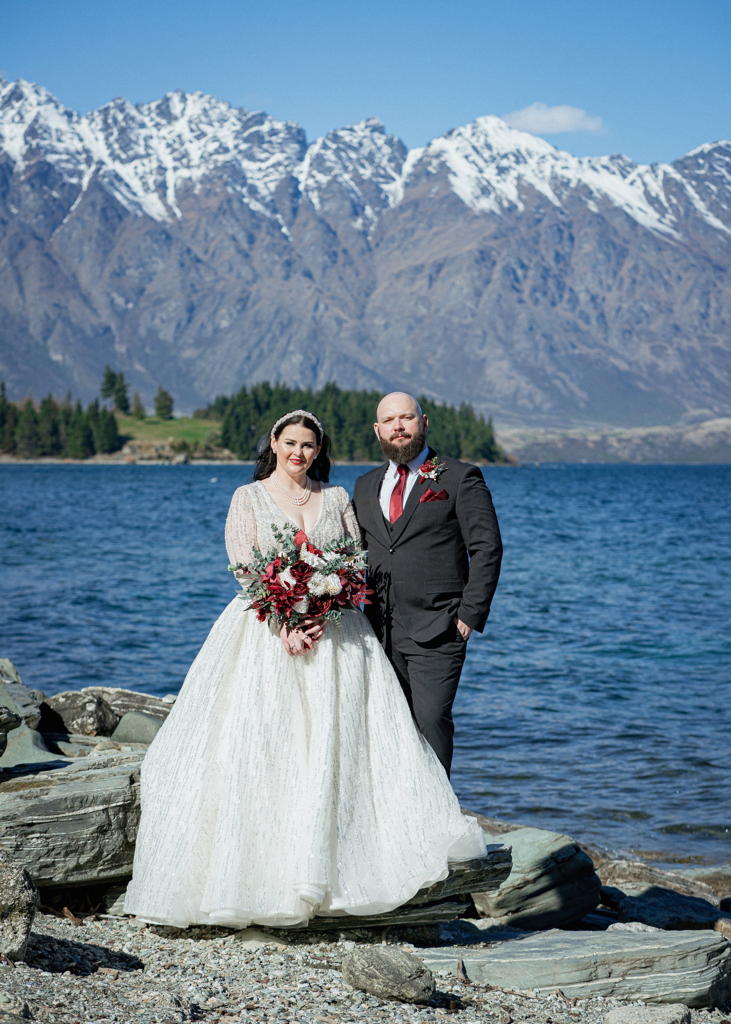    Queenstown winter wedding couple    Snowy wedding portraits Queenstown    Queenstown wedding photographer winter    First look winter wedding Queenstown    Queenstown lakefront bridal party photos    Intimate wedding ceremony Queenstown    Winter 