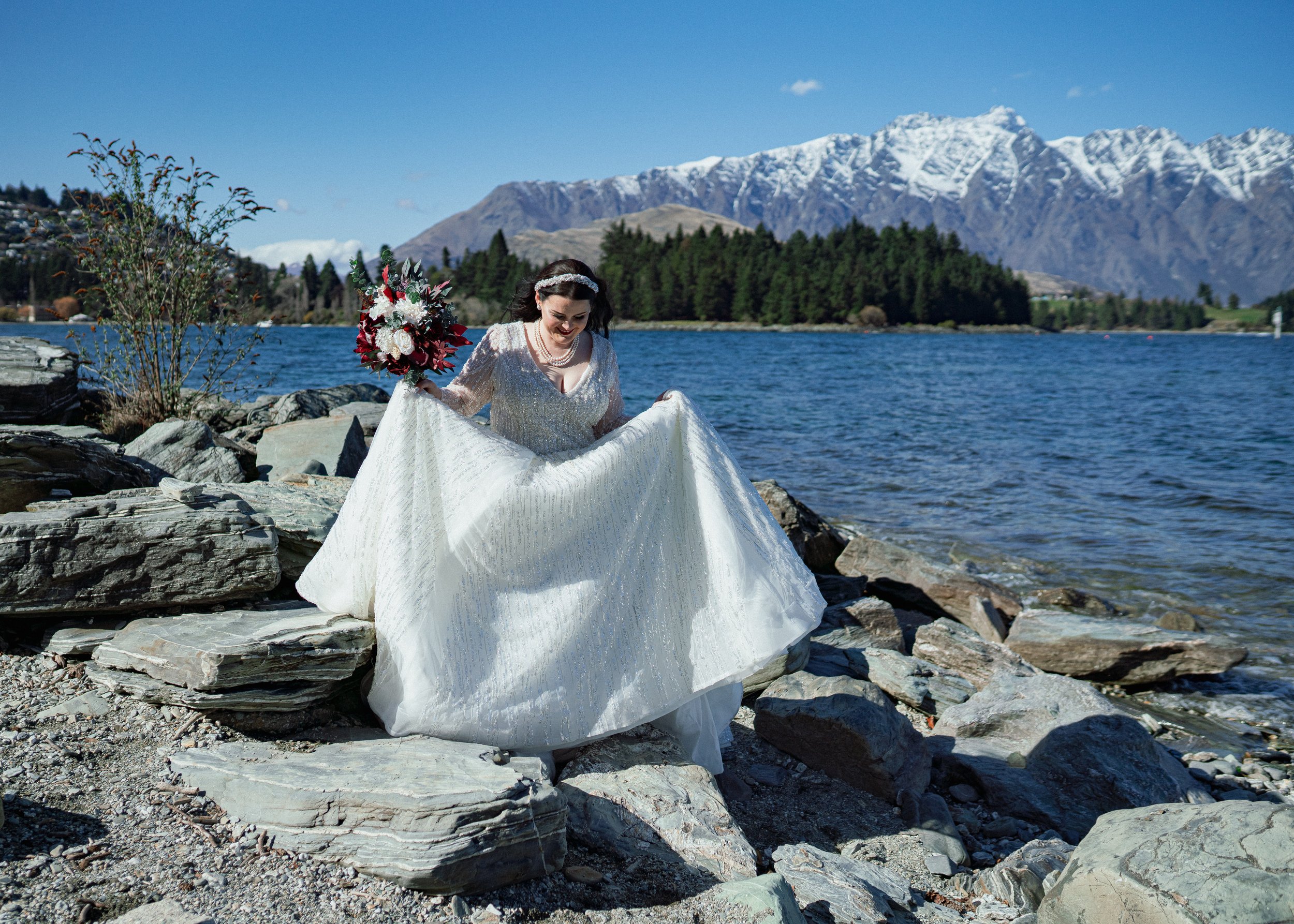    Queenstown winter wedding couple    Snowy wedding portraits Queenstown    Queenstown wedding photographer winter    First look winter wedding Queenstown    Queenstown lakefront bridal party photos    Intimate wedding ceremony Queenstown    Winter 