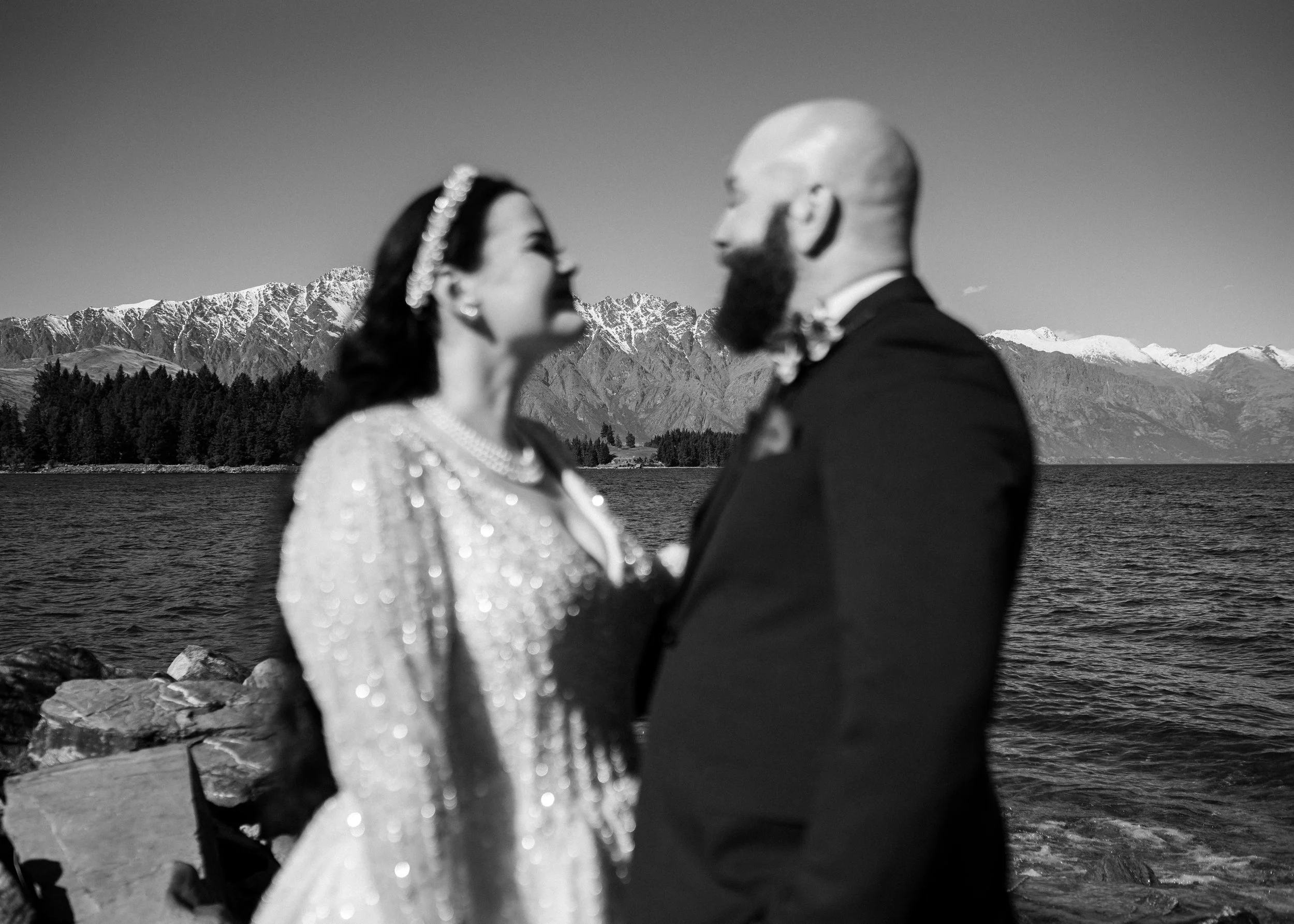    Queenstown winter wedding couple    Snowy wedding portraits Queenstown    Queenstown wedding photographer winter    First look winter wedding Queenstown    Queenstown lakefront bridal party photos    Intimate wedding ceremony Queenstown    Winter 
