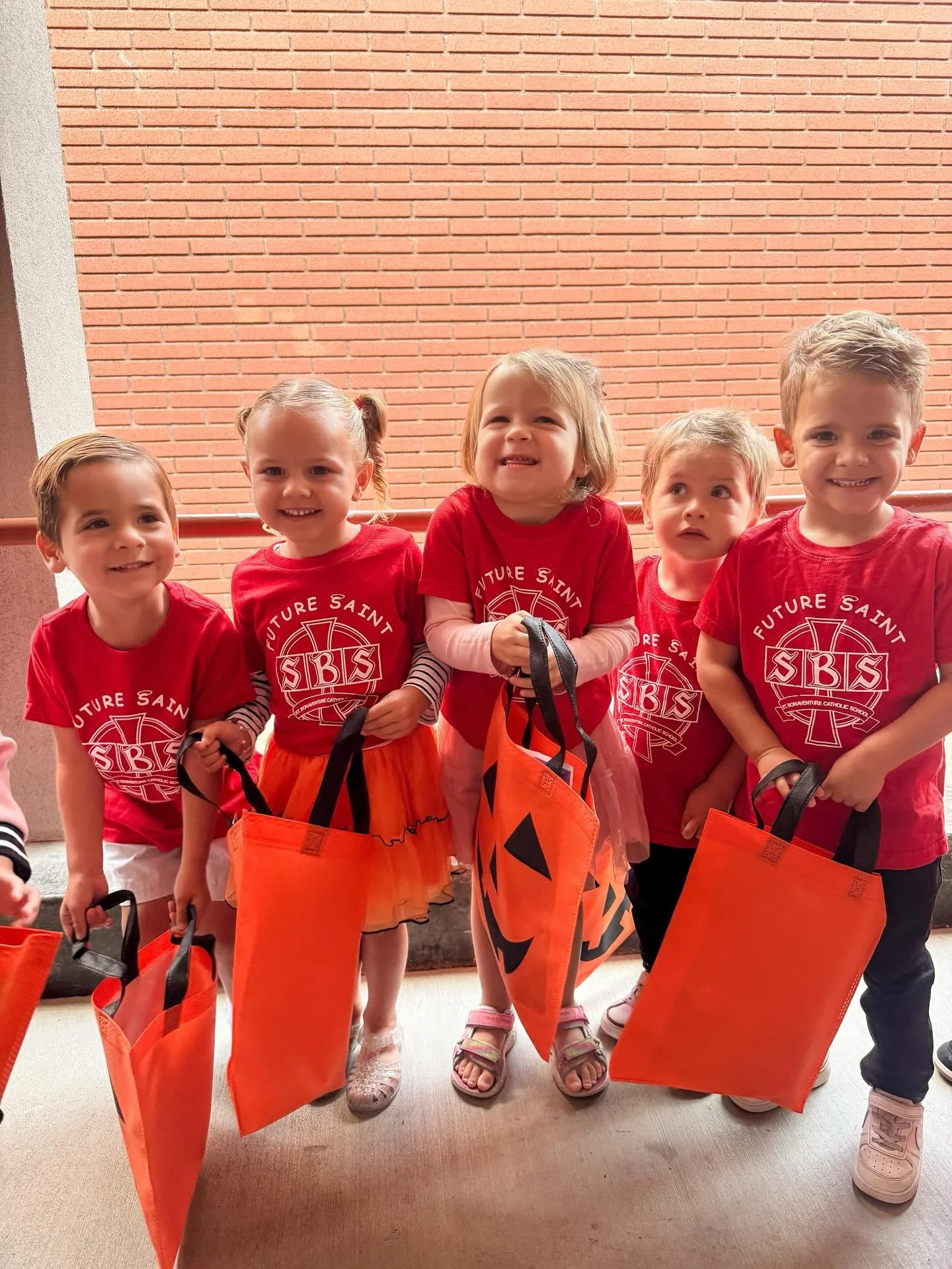 Storytime + trick-or-treating = smiles all around! ππ Our Future Saints had a spooktacular morning thanks to Ms. Denice and our caring SBS staff! 
The next Playdate is Thursday, November 20th at 8:15 am (Thanksgiving theme π¦π)! All are invited! R