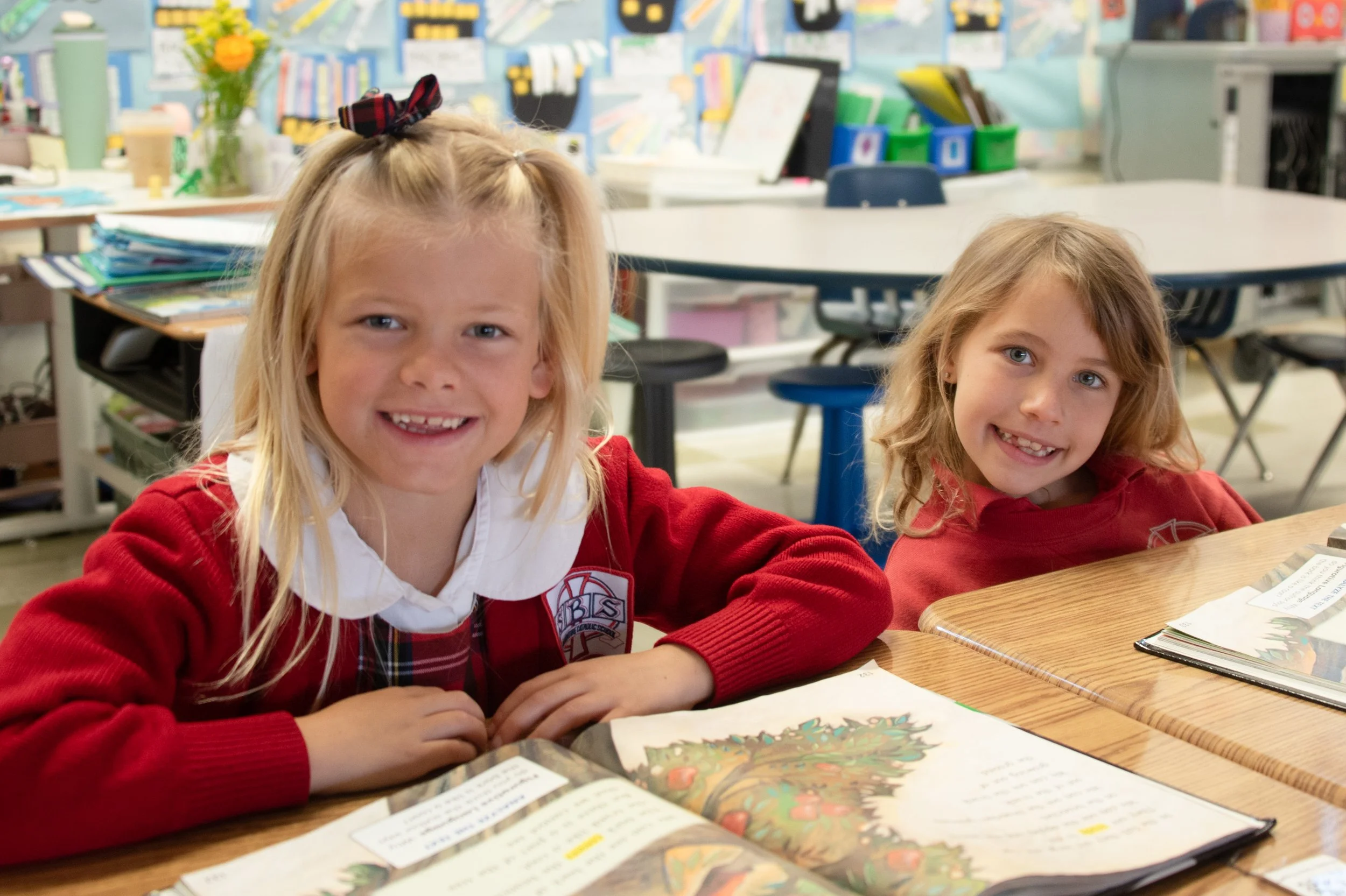 Happy 1st grade students learning