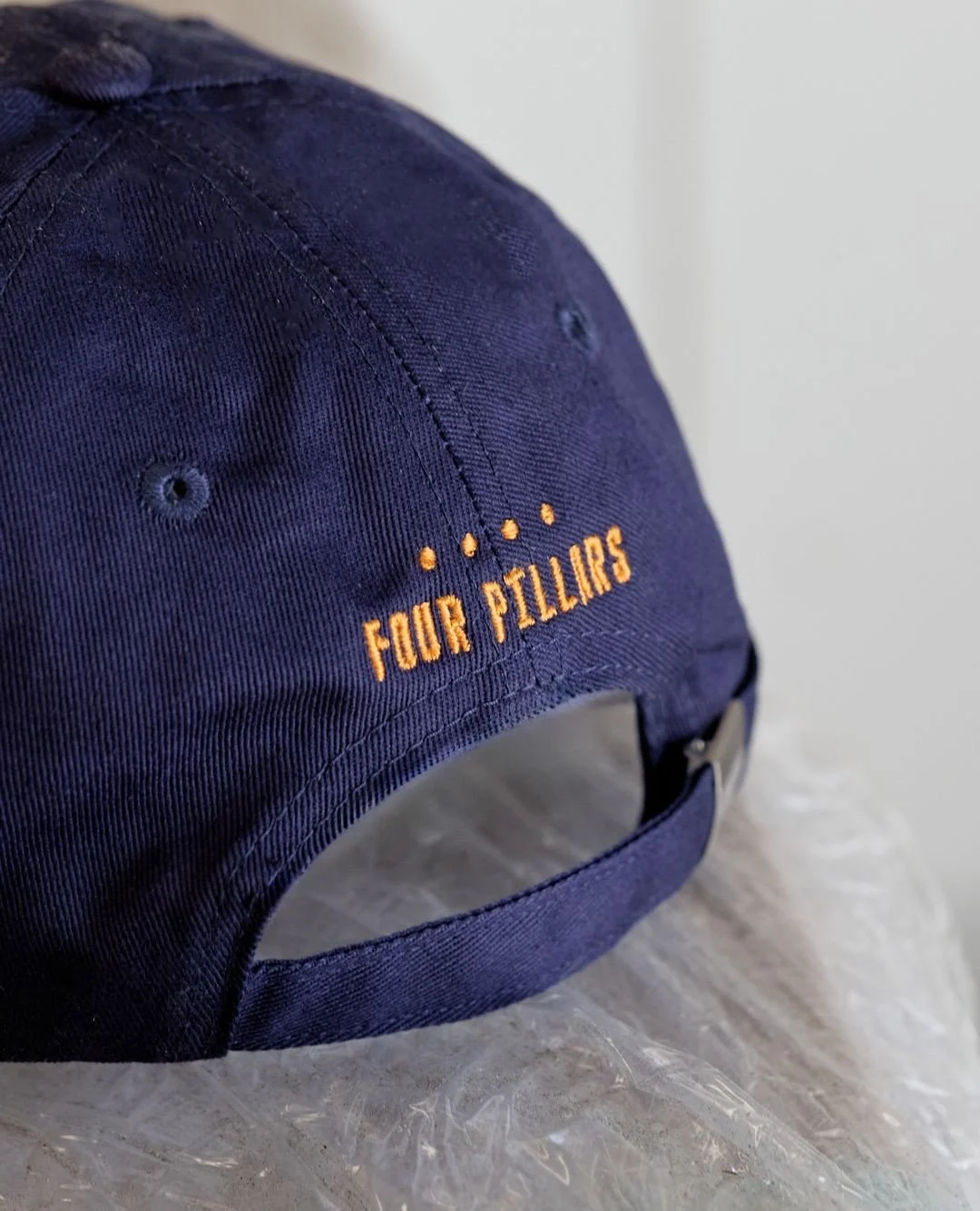 Drink Better Gin! Produced for @fourpillarsgin our @bycontain EVERYDAY low-profile caps in Navy and Black, paired with the DAILY tote in navy to match. Plus a custom dyed mauve cap with an embroidered BLOODY (shiraz) slogan. ⁠
⁠
⁠
#merch #makeityouro