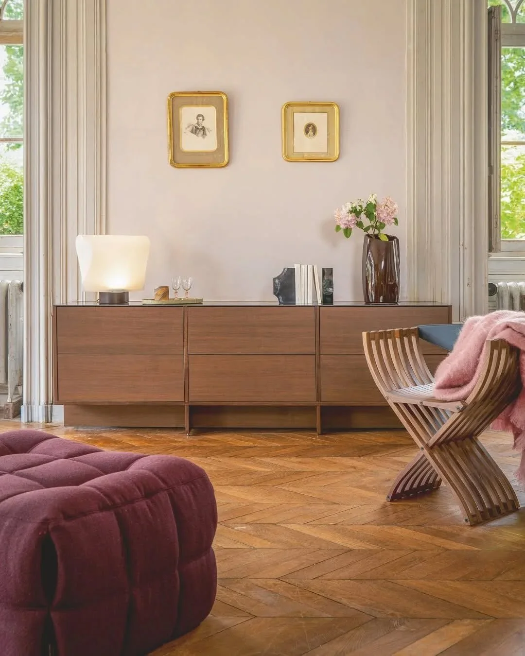 In a curated living space, Kashima and Curule converge as sculptural companions. The Kashima sofa&rsquo;s enveloping curves and rich textures offer a tactile embrace, inviting moments of pause. Complementing this, the Curule chair stands a testament 