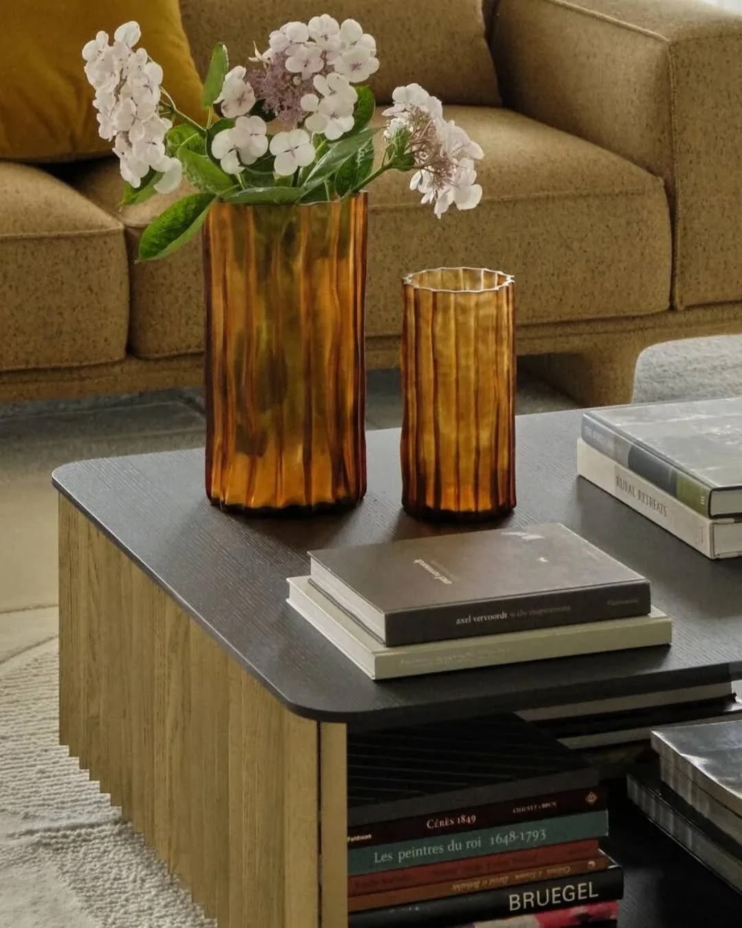 Elevate your living room with sculptural grace. These ribbed vases, crafted in layered mouth-blown glass, catch the light at every curve, turning everyday decor into a vision of refined luxury.

#InteriorDesign #Decor #Vase