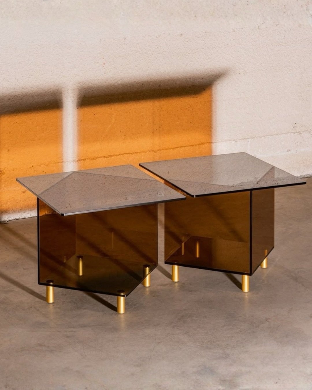 Albers coffee tables by @marieaurorestikermetral ​

With a smoked glass top and base, amber glass sides and brass legs, this table offers the perfect combination of style and functionality to complete any living space. ​

Smoked-tinted tempered glass