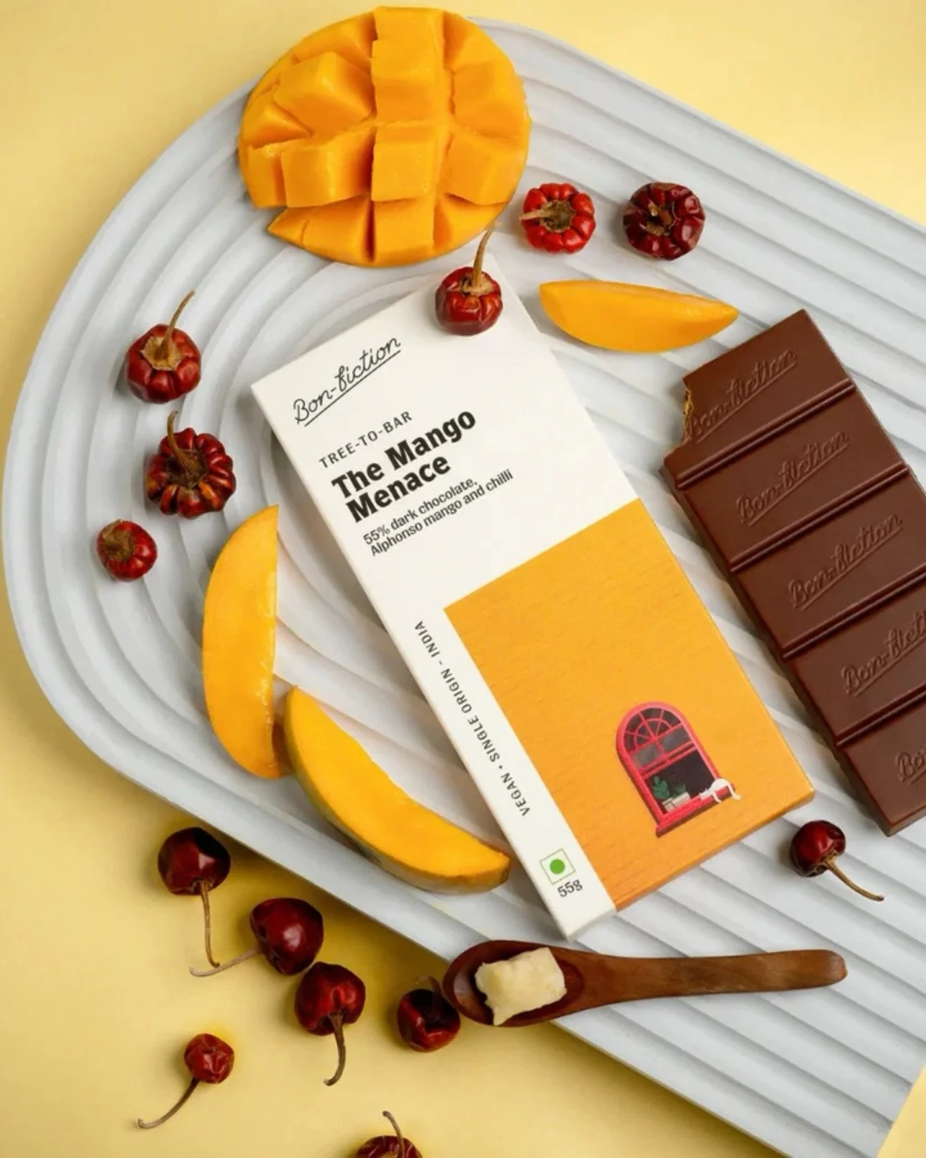 A tropical twist, thoughtfully crafted.​
​
Made with 55% dark chocolate, this creation brings together the sweetness of Alphonso mango and the gentle heat of Mundu chilli. The result is layered, unexpected, and perfectly balanced, where fruit meets s