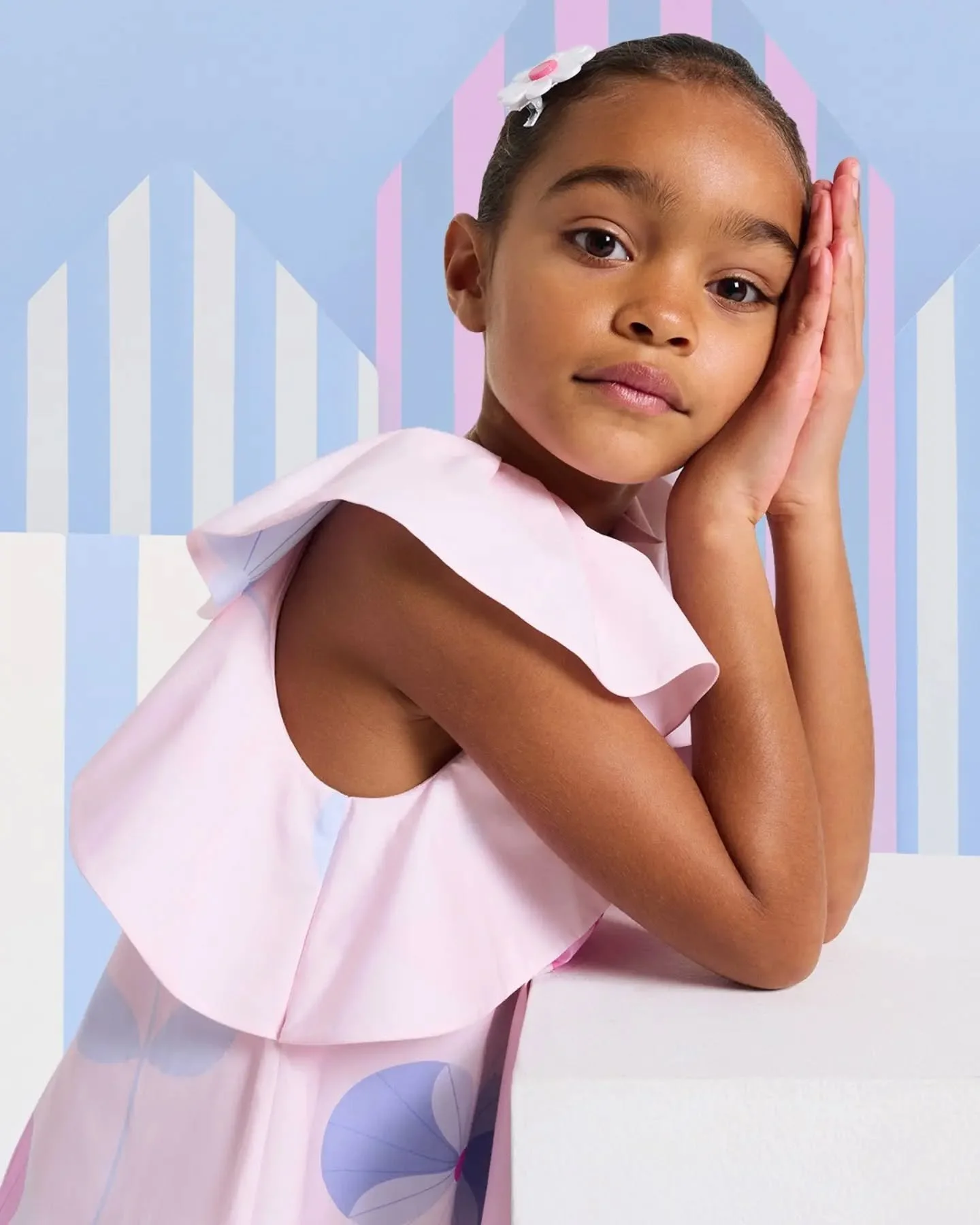 Designed to flutter with every movement.

 The wide butterfly sleeves bring soft structure and elegant charm to this floral summer dress.

Available in store and online.