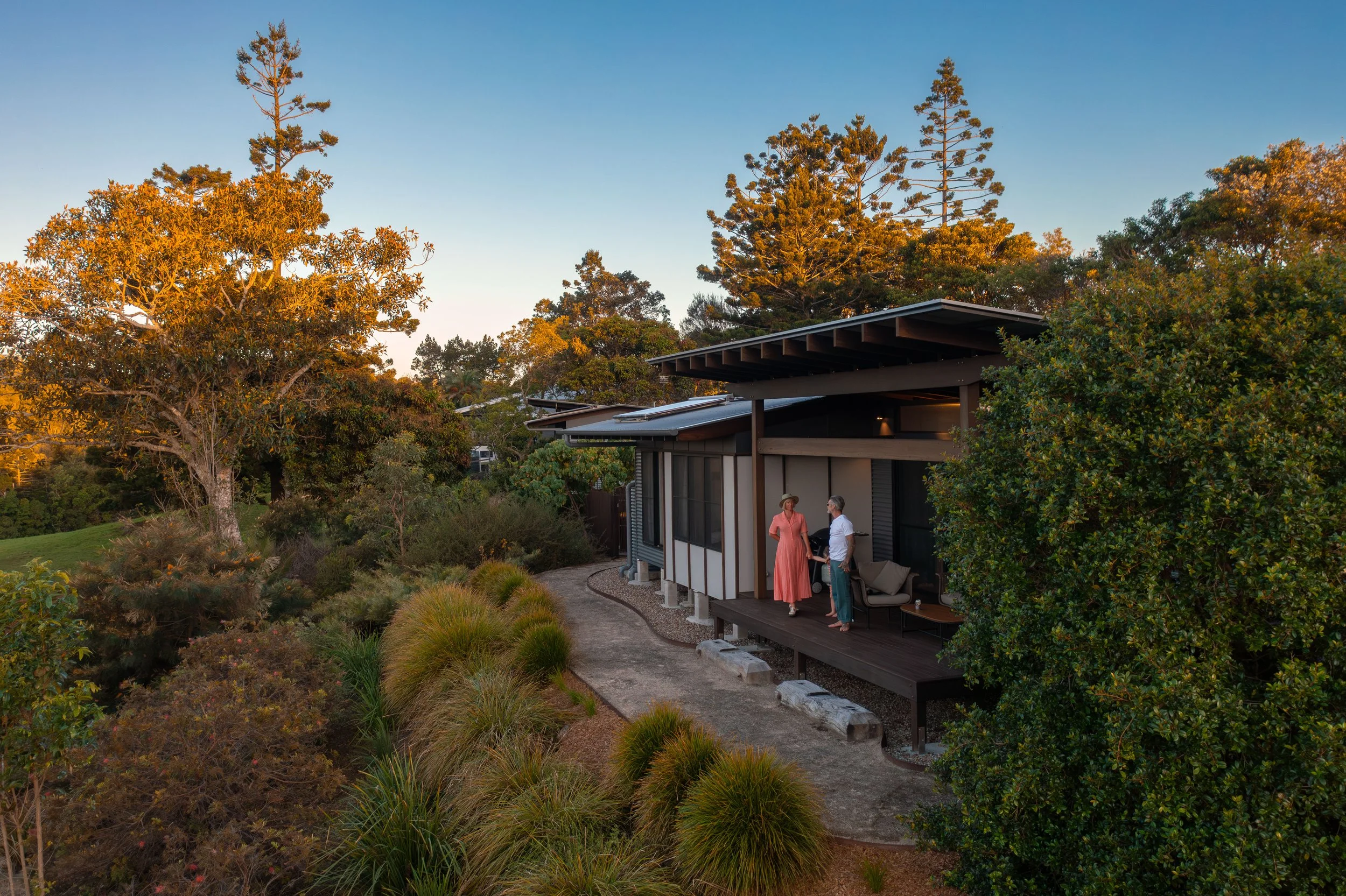 Carinya villa with people on deck looking out to the trees