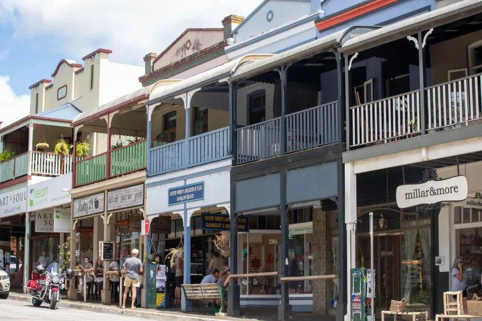 image of bangalow town with stores and cars on road