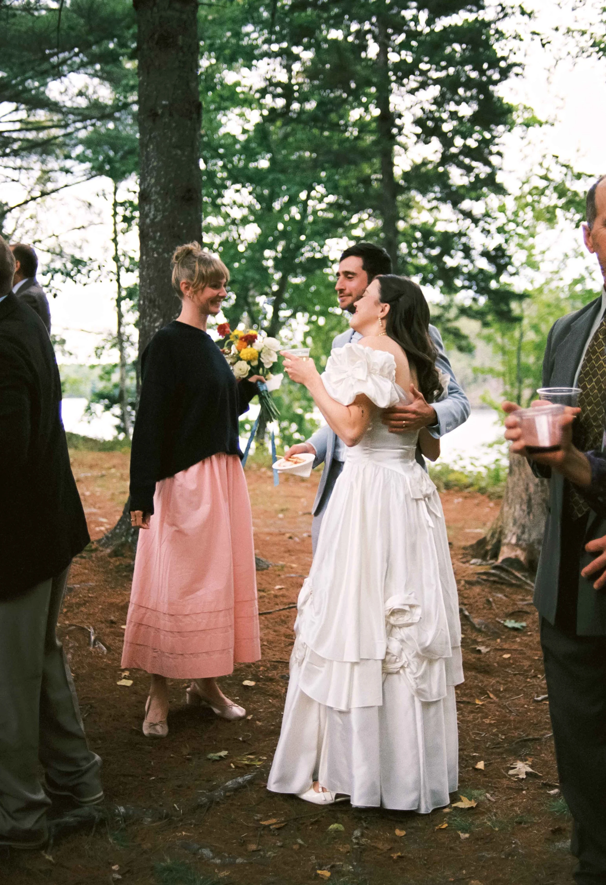 Candid of the bride and her friend hugging
