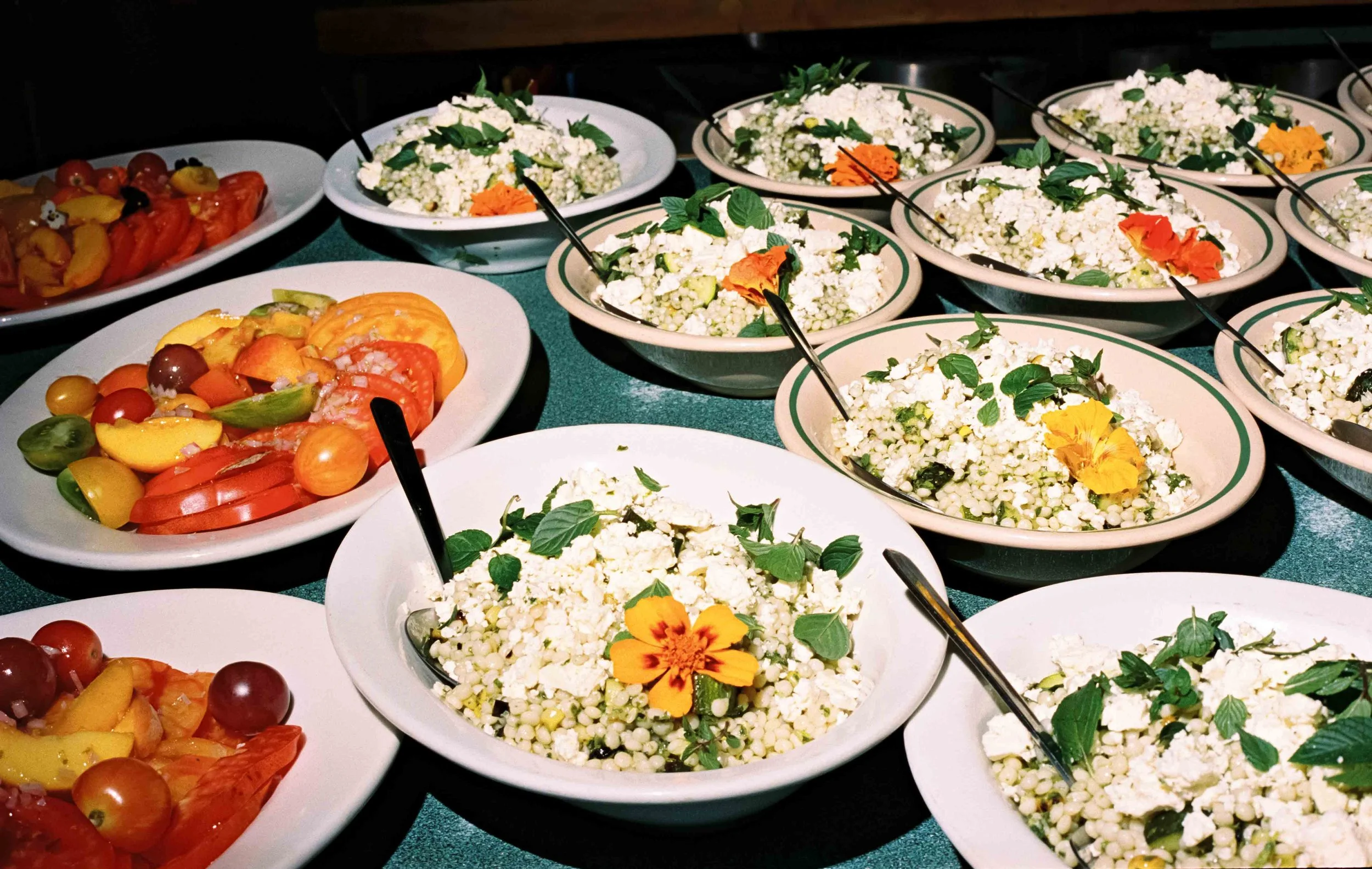 Delicious looking cous cous and tomatoes in dishes