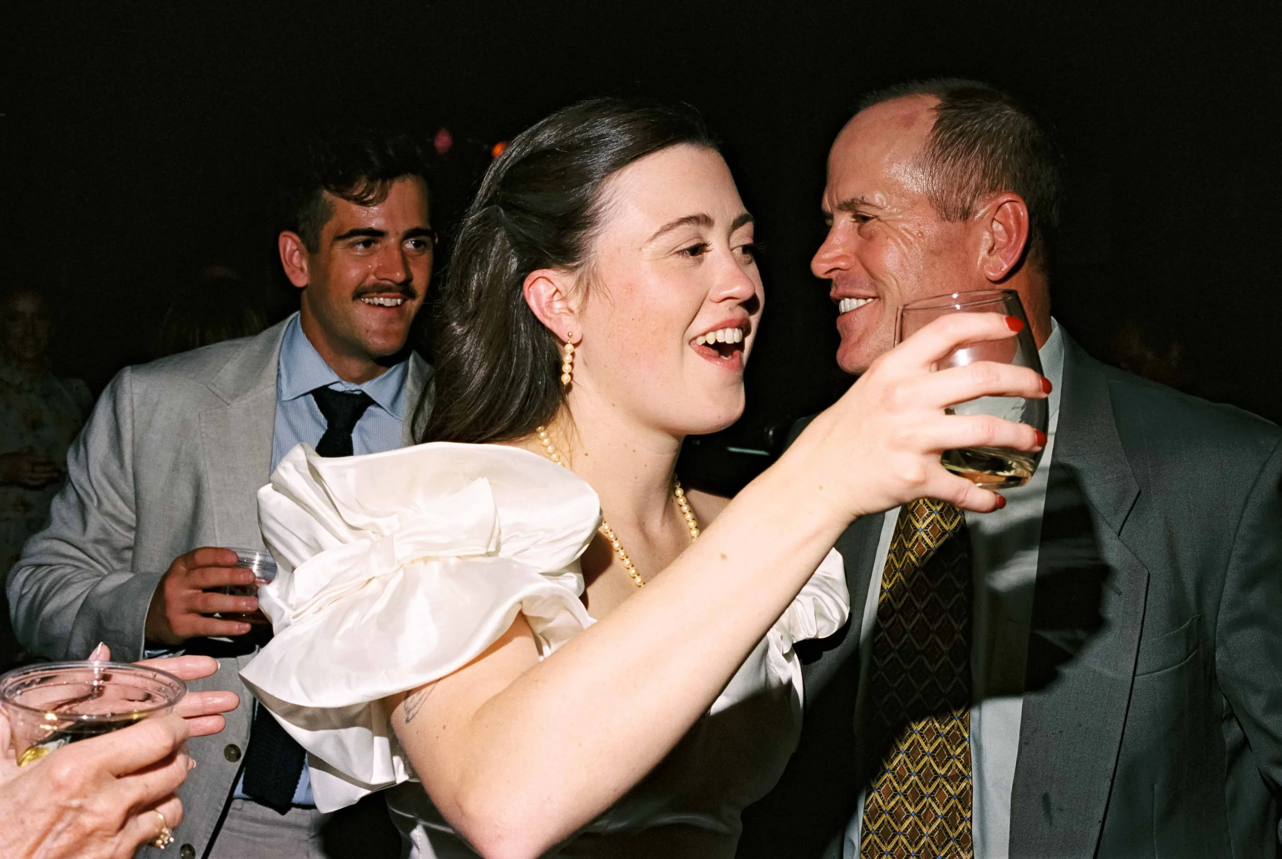 Candid dance floor moment captured on film at a Maine Camp wedding