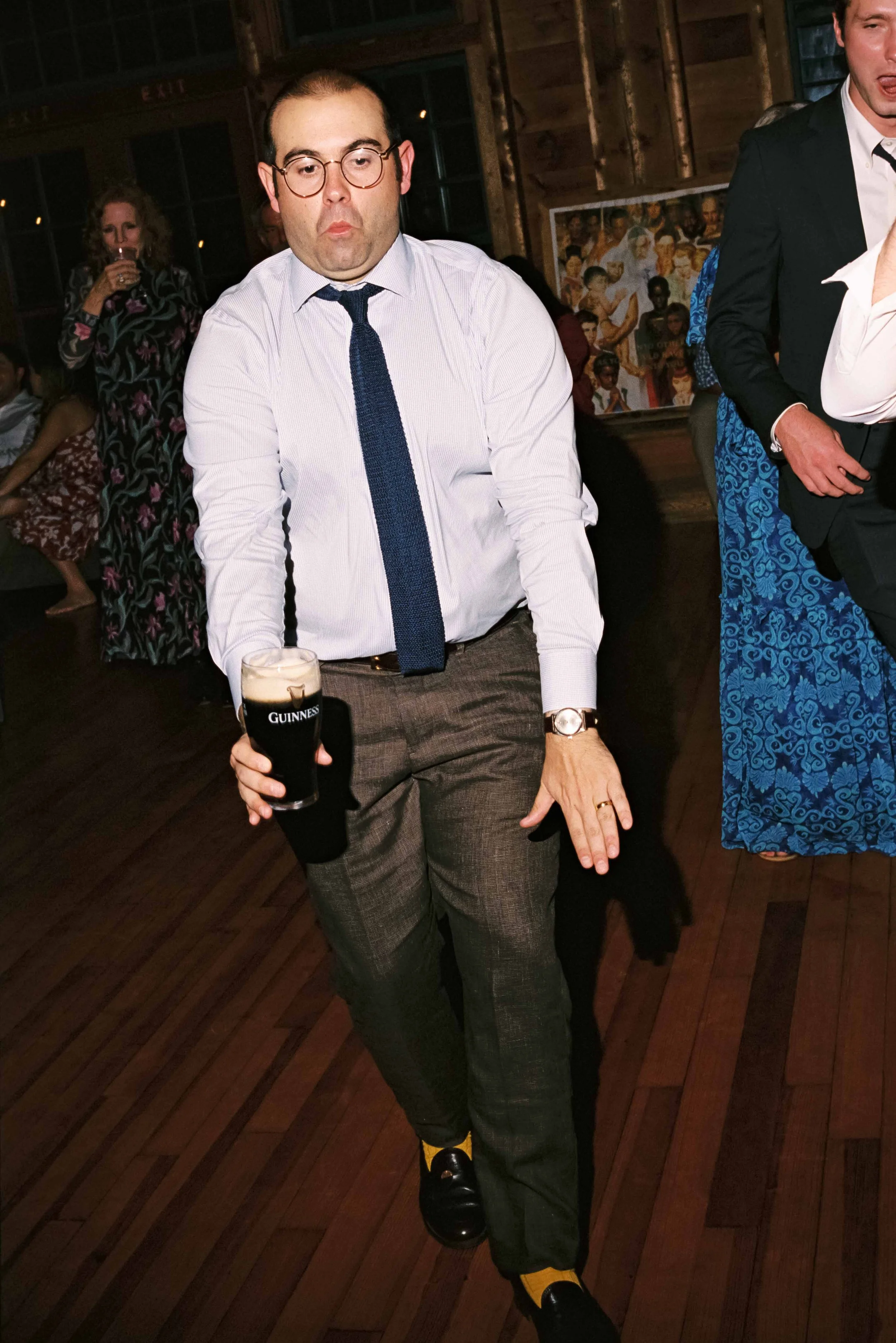 Candid dance floor moment captured on film at a Maine Camp wedding