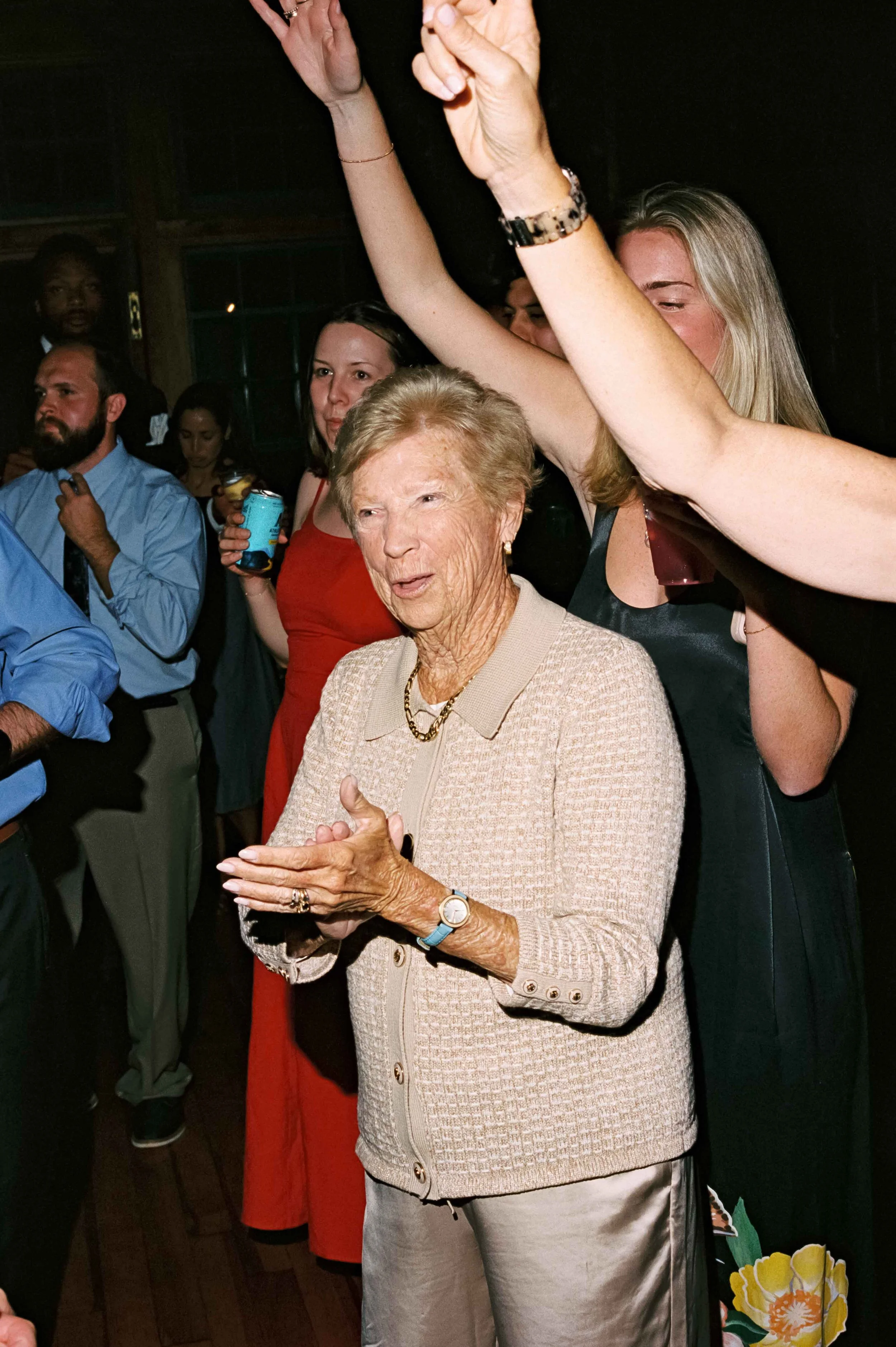 Candid dance floor moment captured on film at a Maine Camp wedding