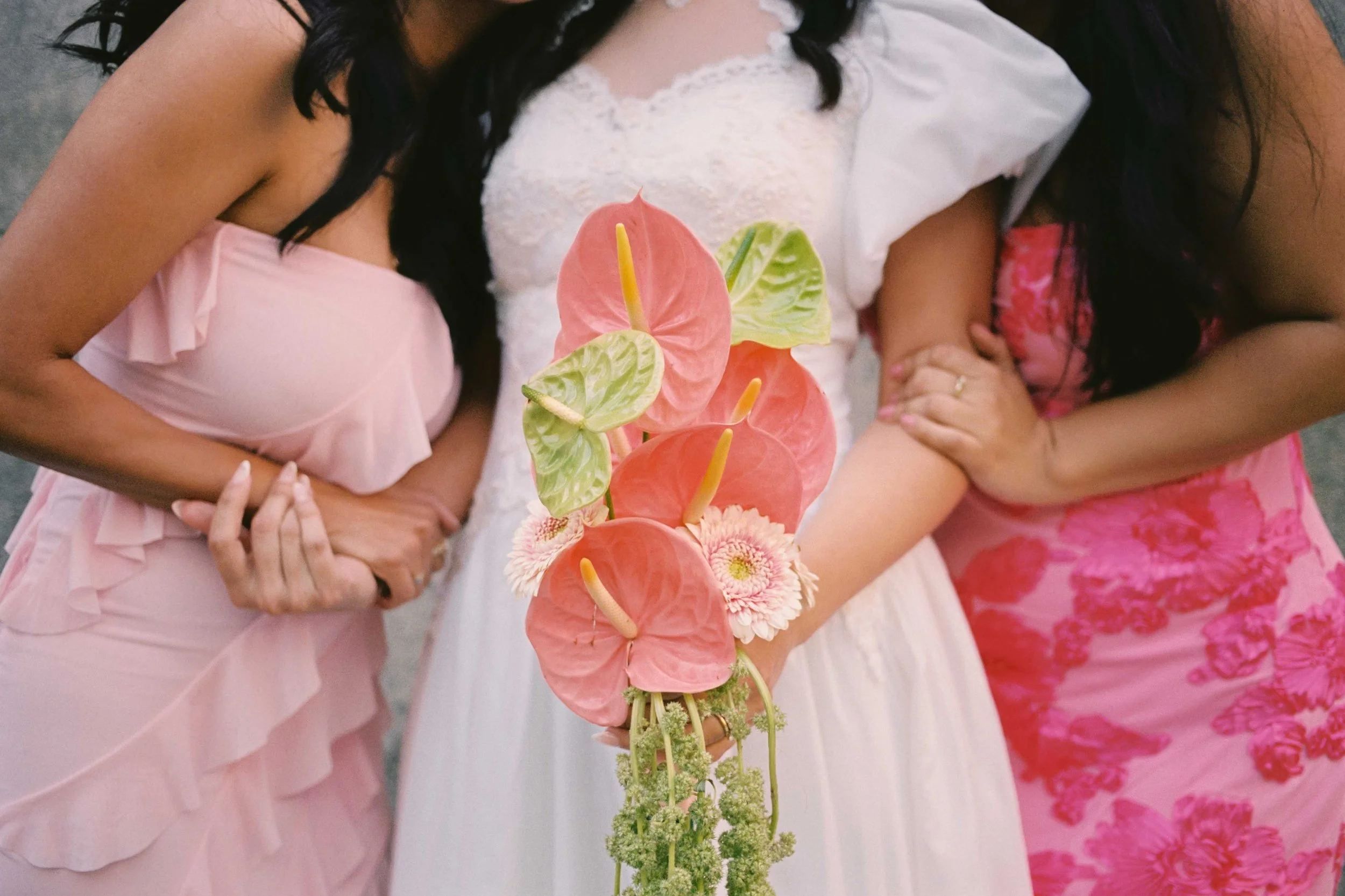 Pink bridesmaids dresses and bride bouquet