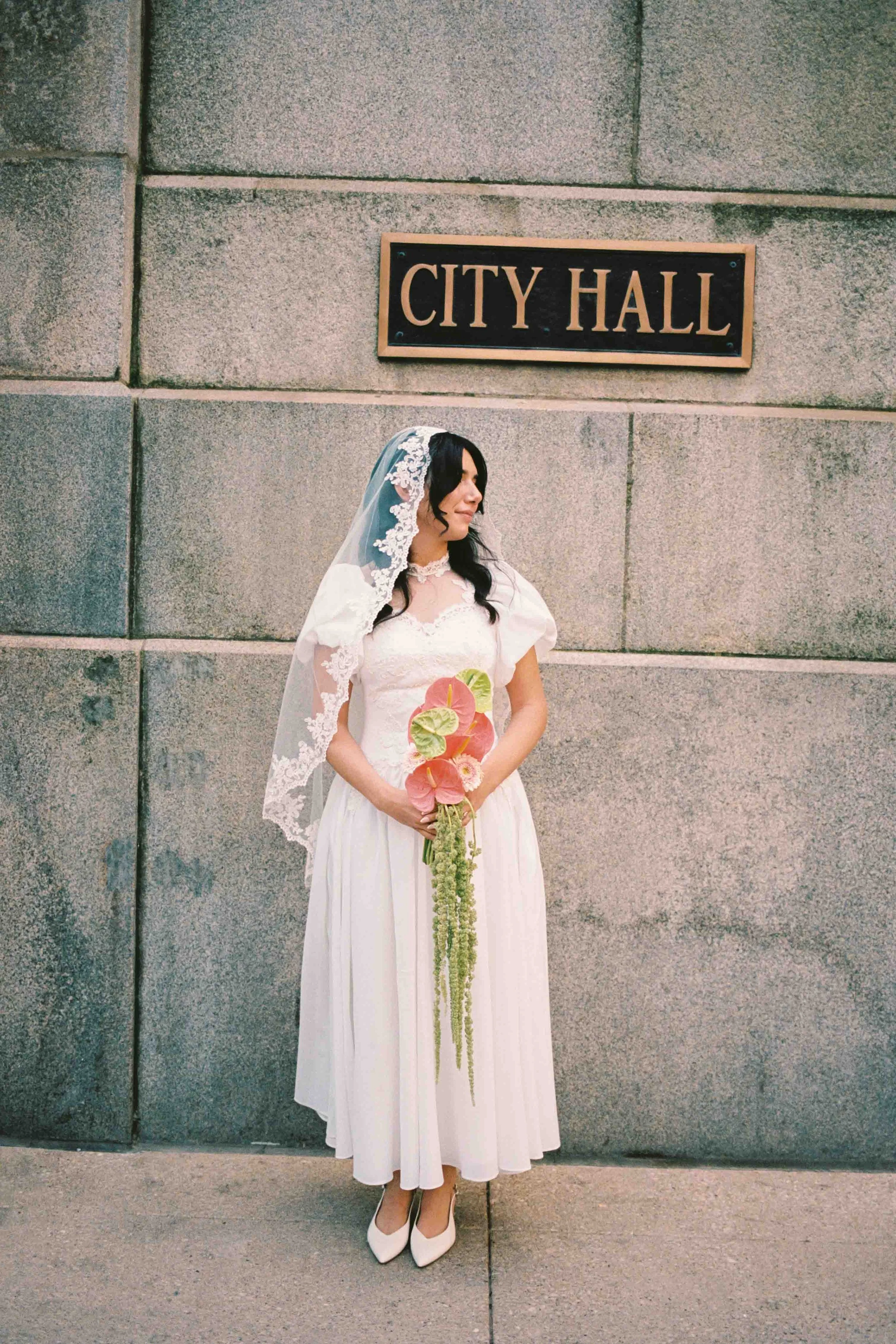 Bridal portrait by Chicago City Hall sign