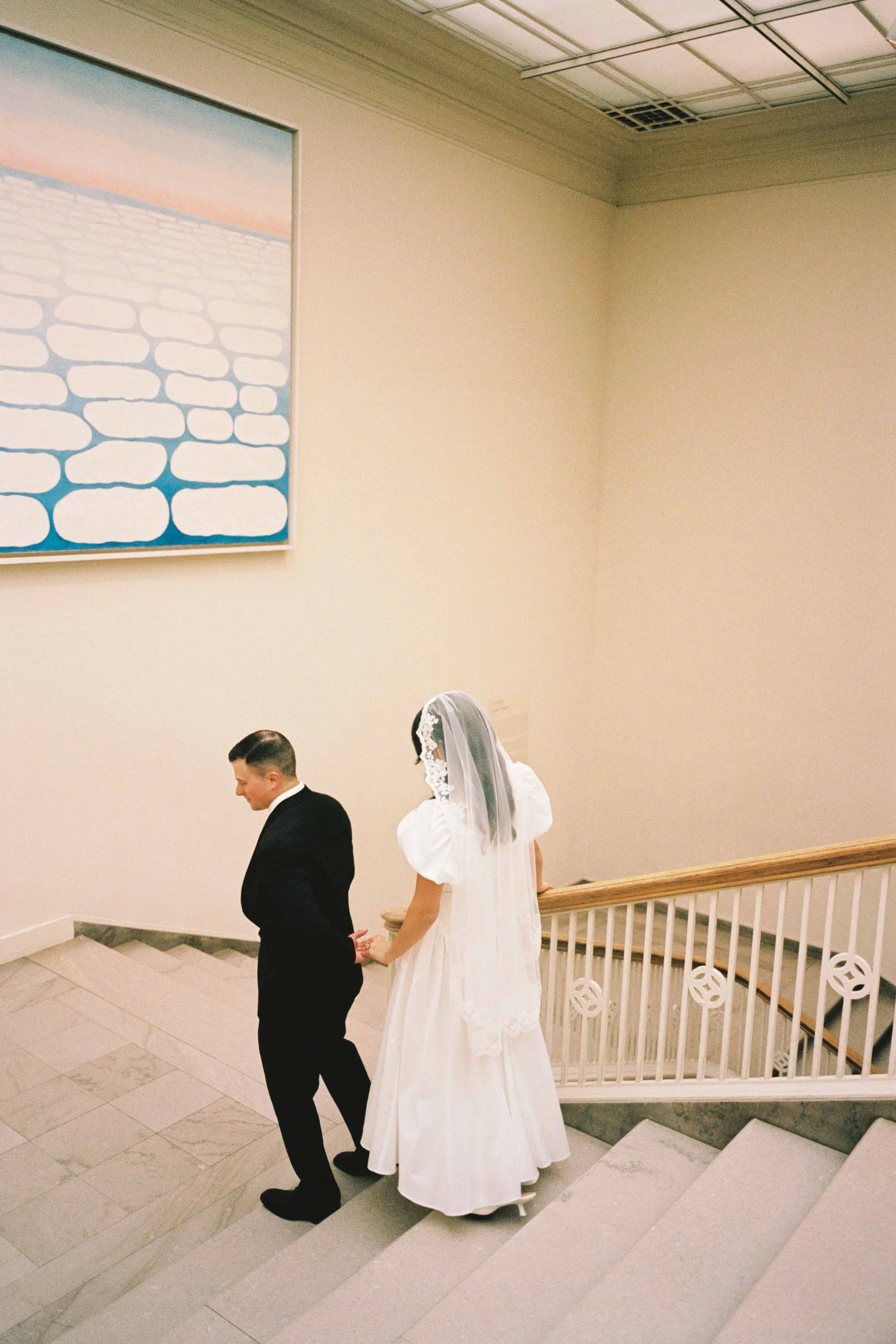 Artful film photo of a wedding couple at the Chicago Art Institute
