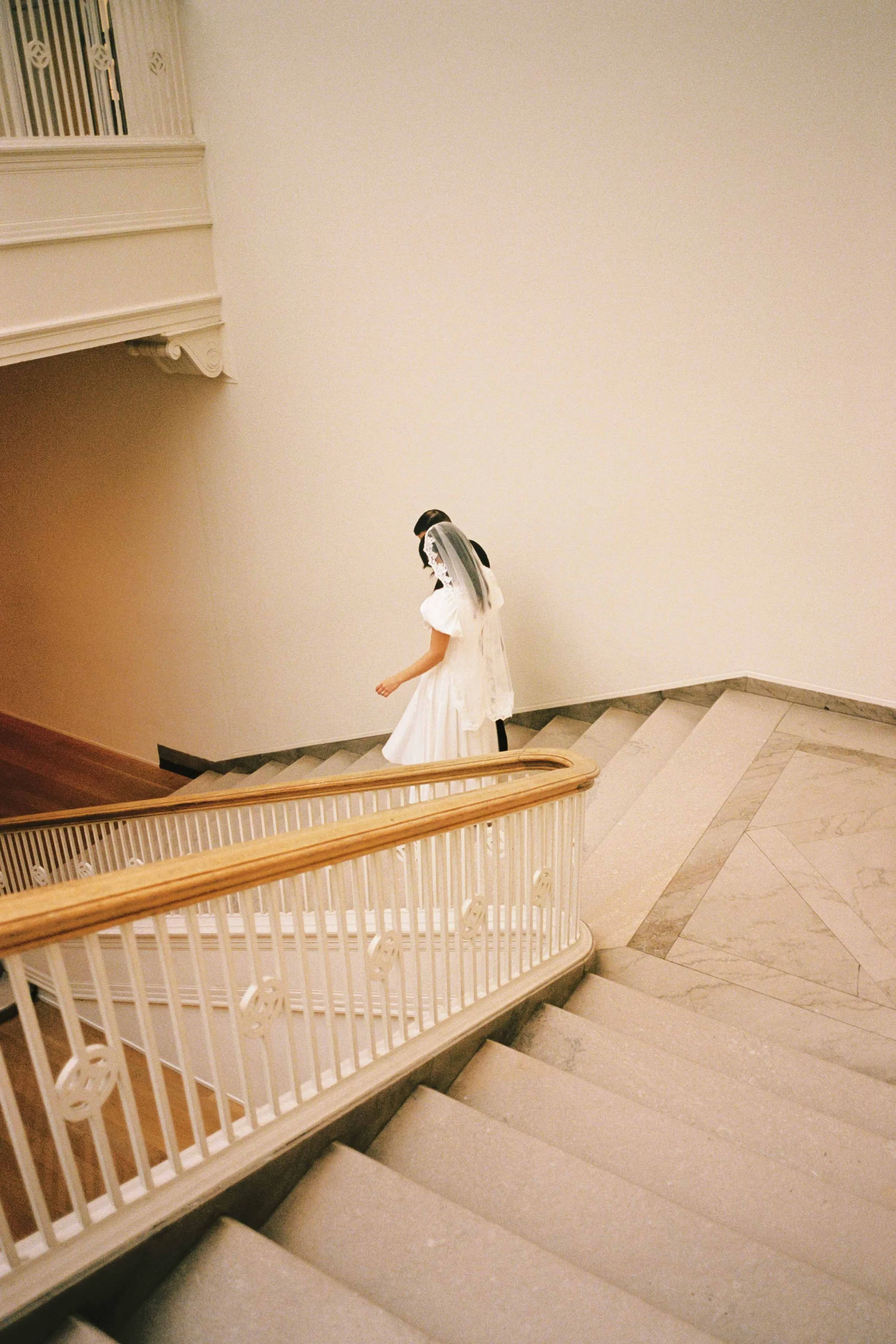 Artful film photo of a wedding couple at the Chicago Art Institute