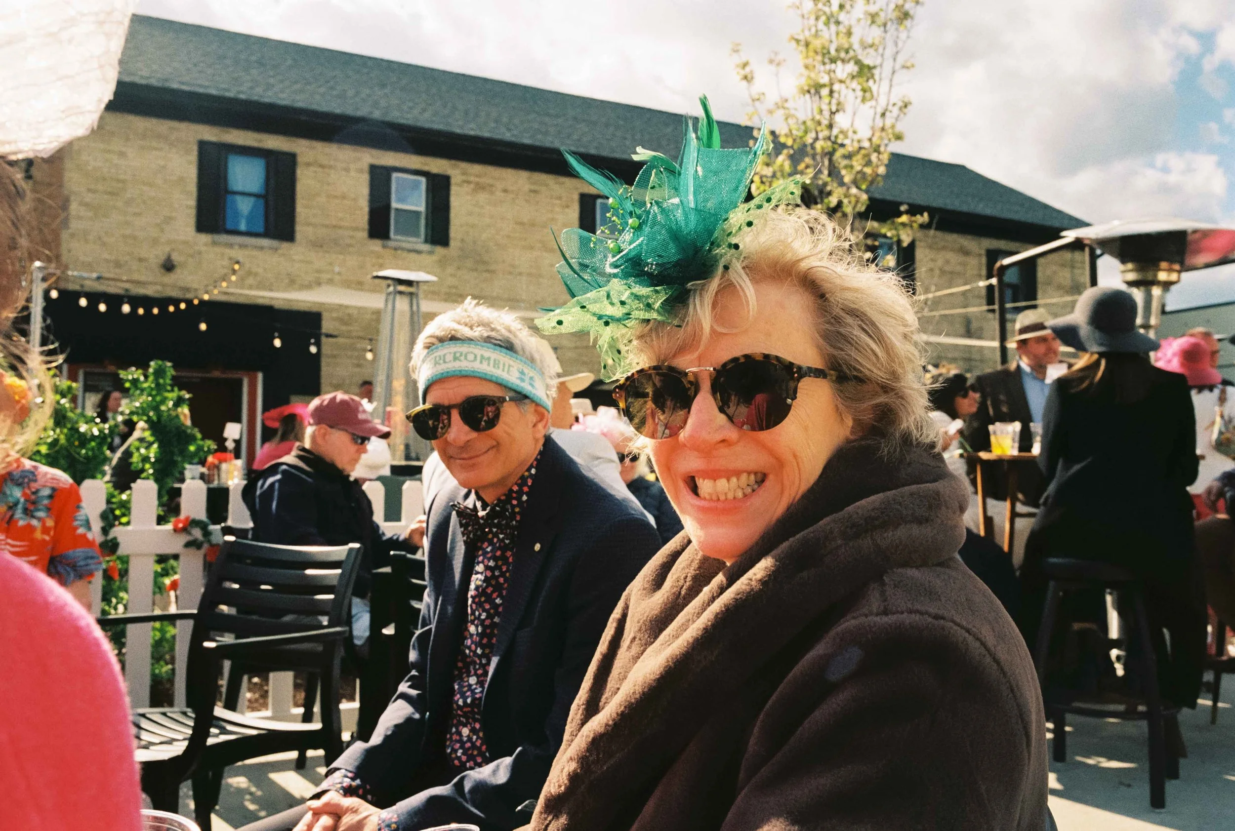 Couple smiling at the camera during the Kentucky Derby