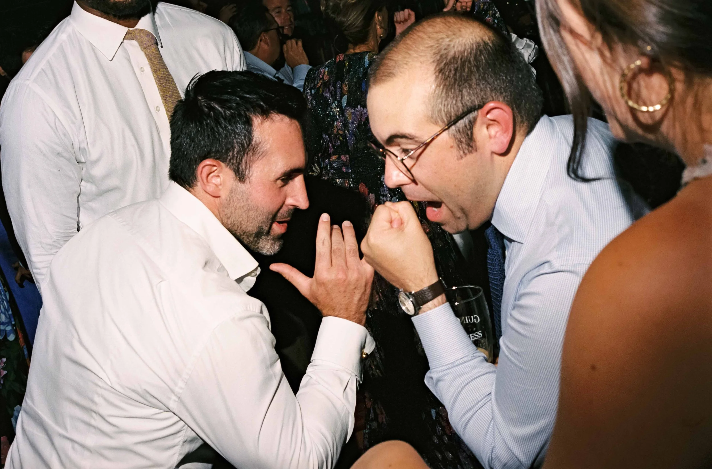Candid dance floor moment captured on film at a Maine Camp wedding