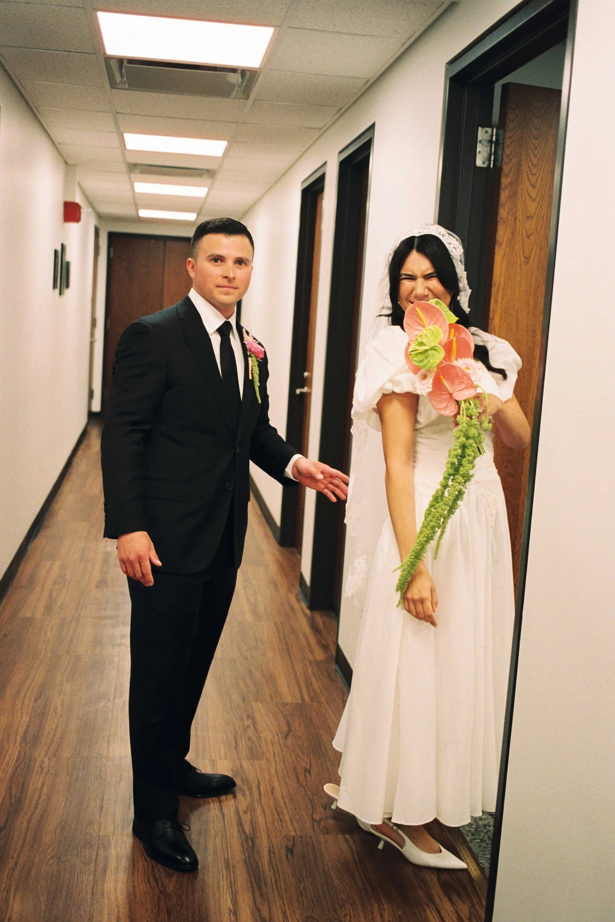 Couple smiling going into the ceremony room on their elopement day in Chicago