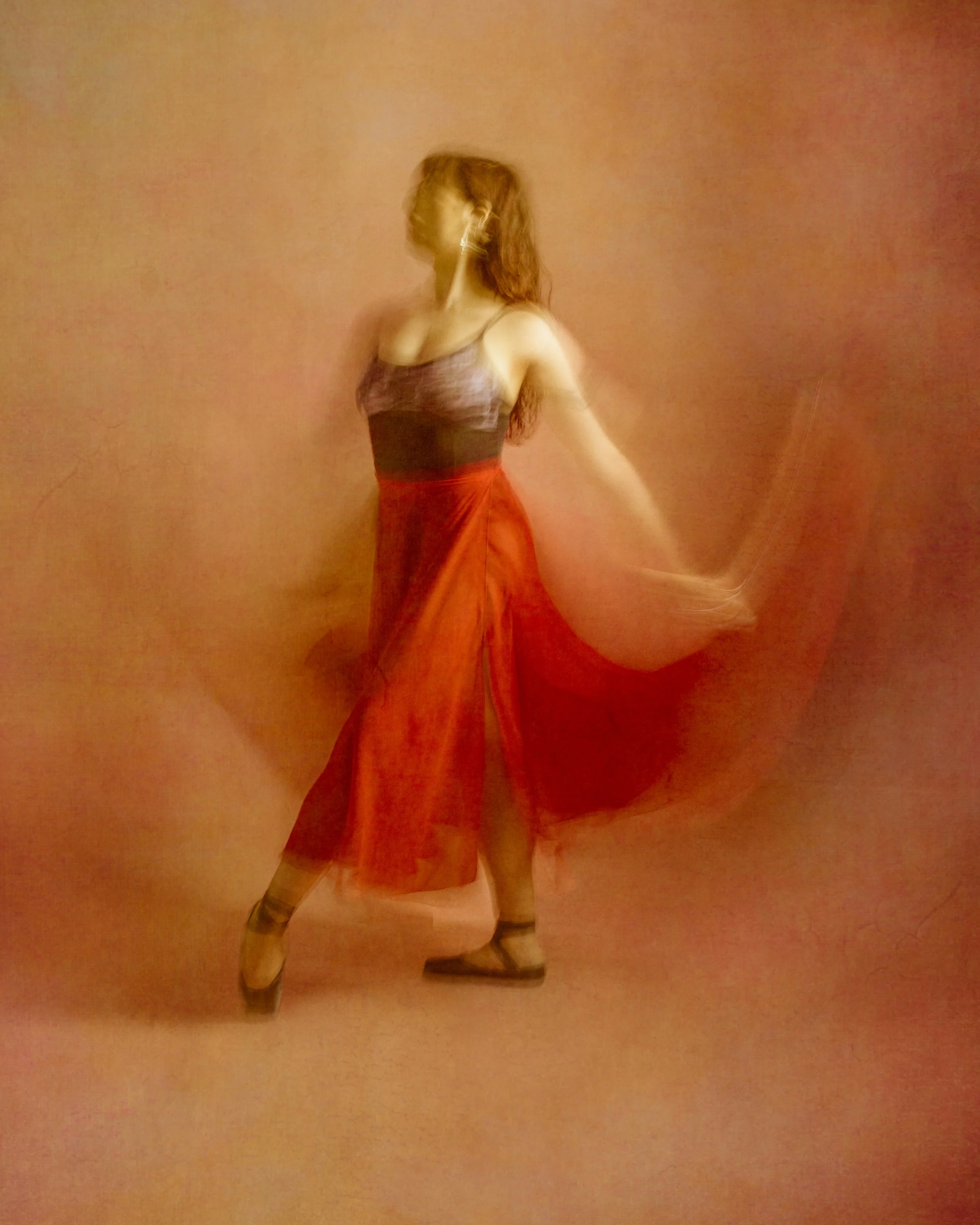 A ballet dancer moving their skirt to create a sense of movement