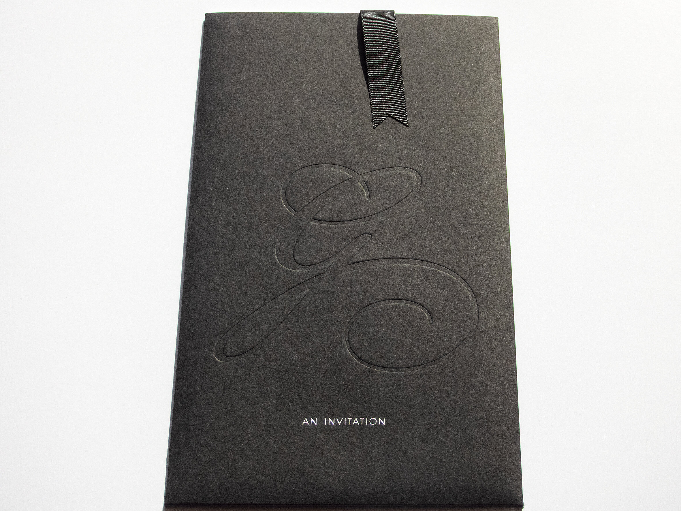 Bespoke invite sleeve, debossed, foiled