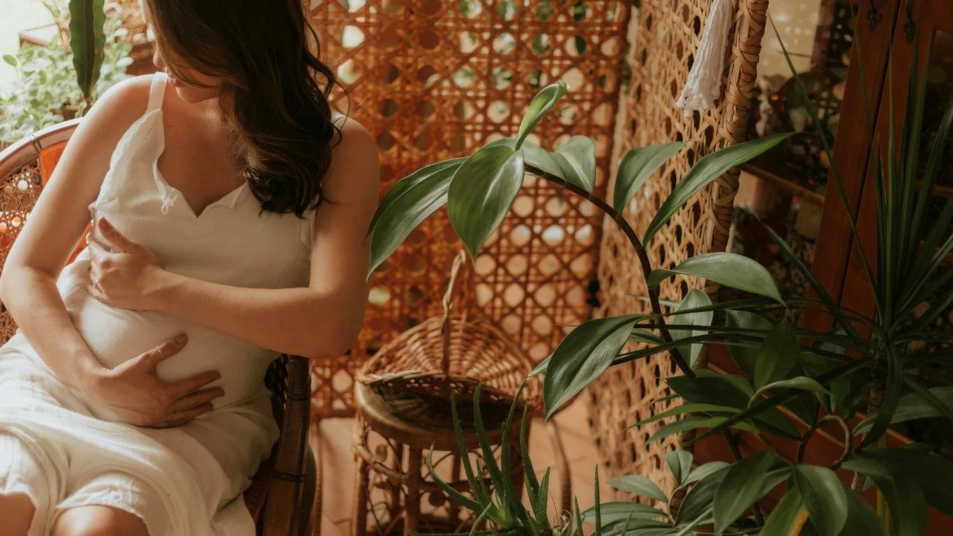 A woman preparing thoughtfully for birth, representing trauma-informed birth preparation for neurodivergent and sensitive mothers