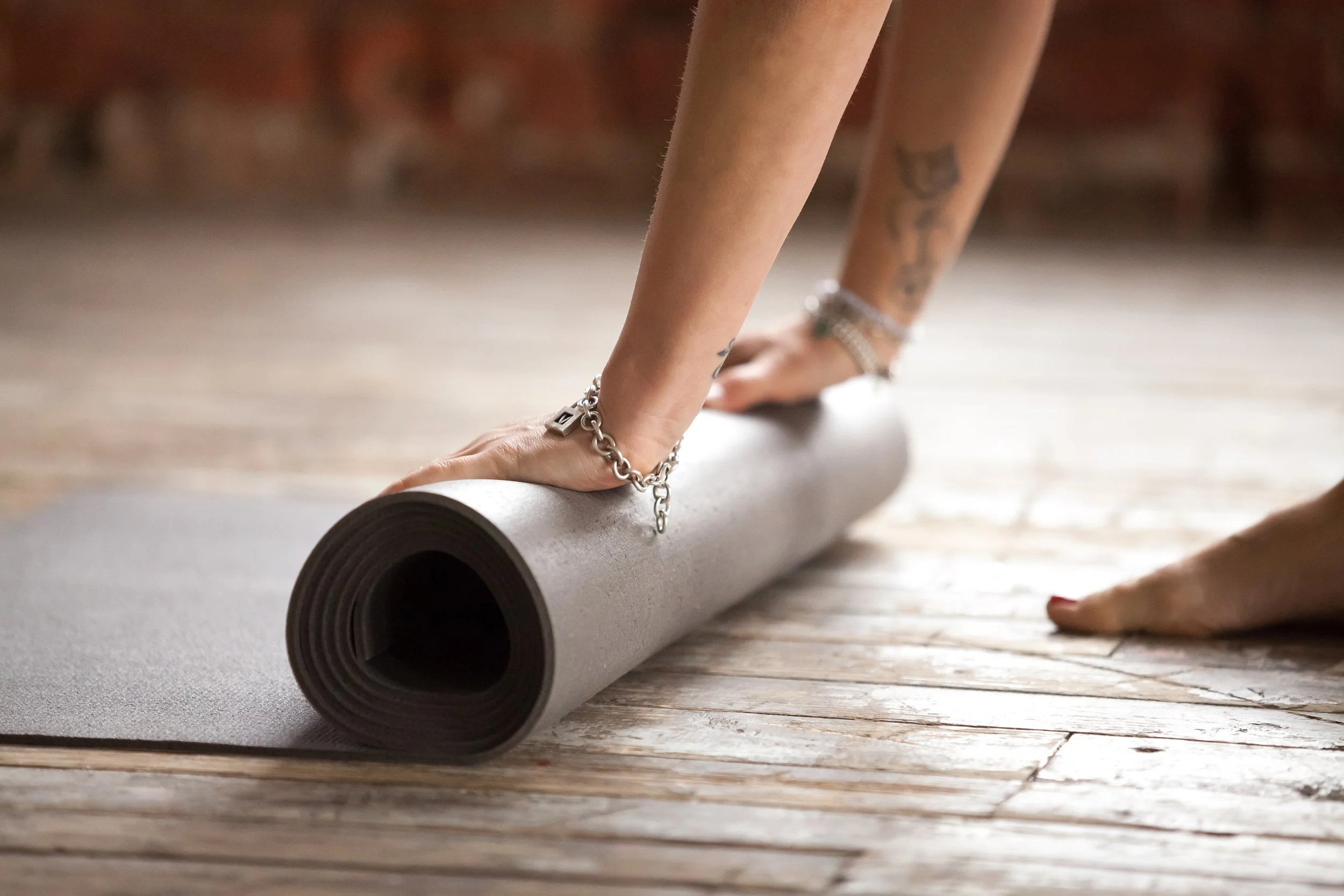 hands-rolling-fitness-mat-concept-healthy-lifestyle.jpg