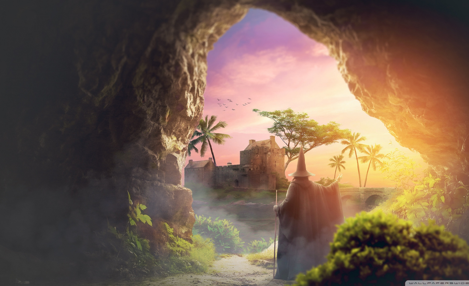 Castillo en un paisaje tropical con un mago caminando hacia él desde una cueva al atardecer, con palmeras, árboles y un cielo rosado