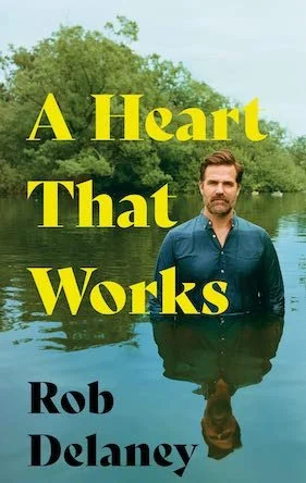 Rob Delaney standing in a pond on the cover of a heart that works