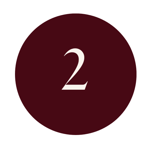 A dark maroon circle with the number 2 in white centered inside