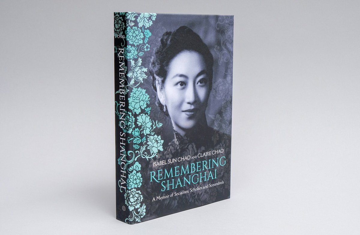 A hardcover copy of Claire Chao's Remembering Shanghai, standing up on a neutral gray background