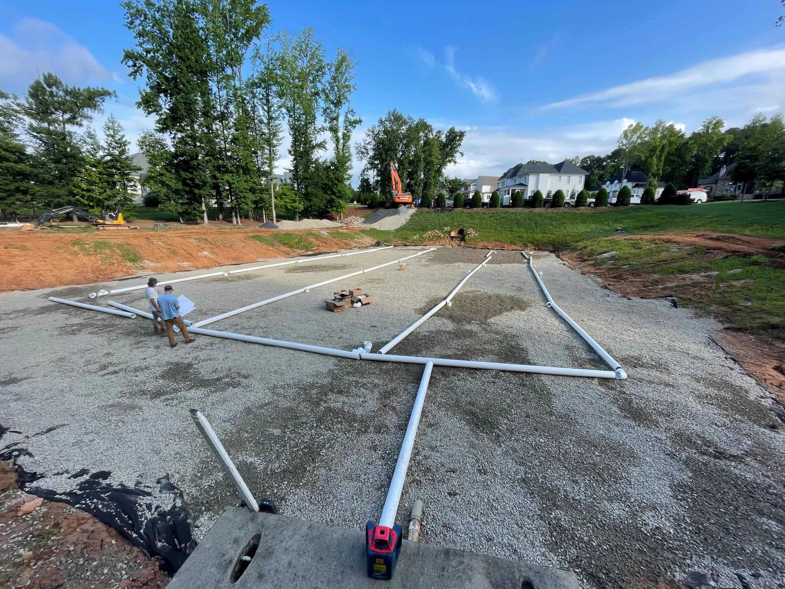 Stormwater construction area with gravel and piping.