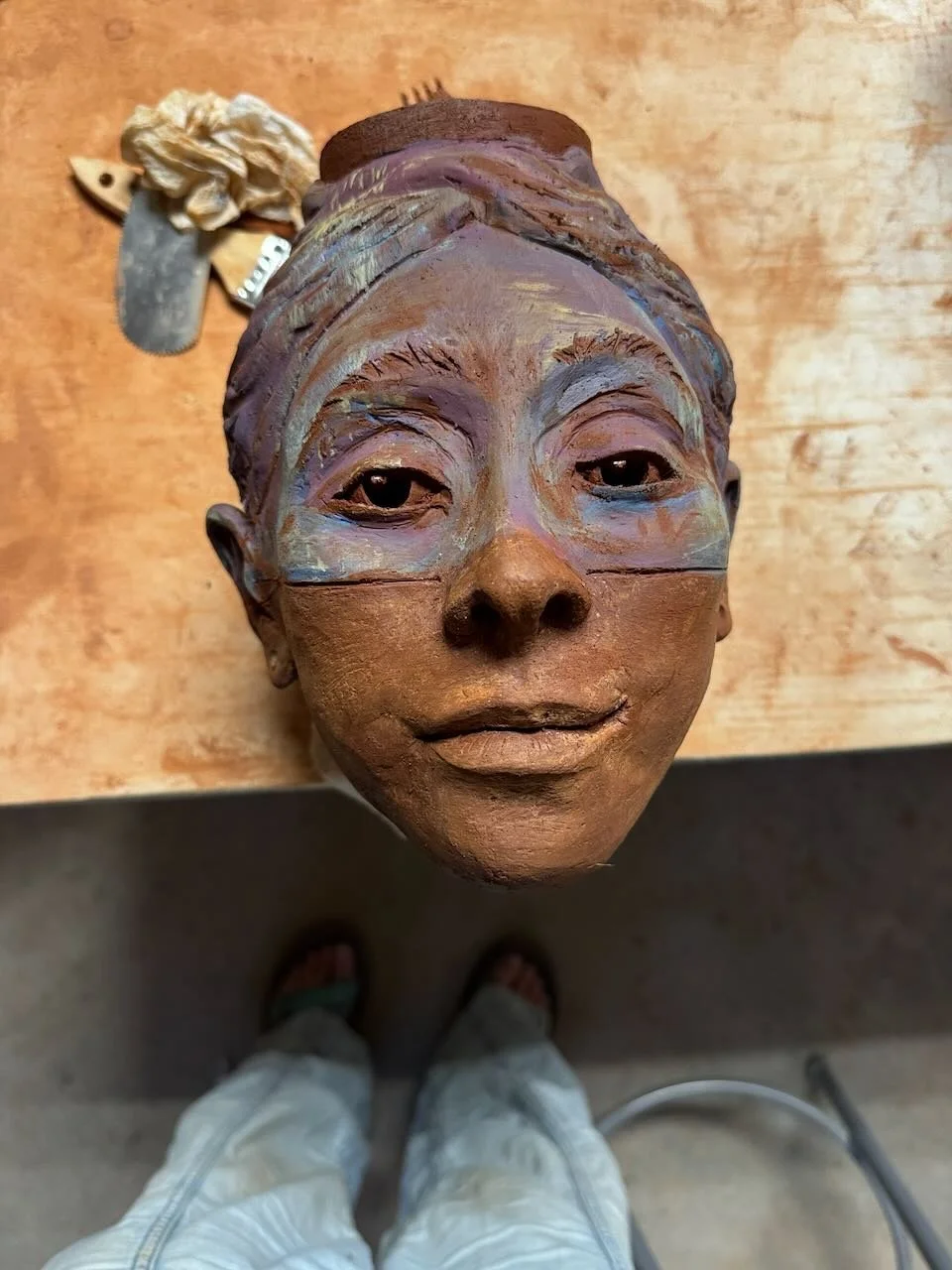 Sculpture of a goddess head by jenny snaza 2026