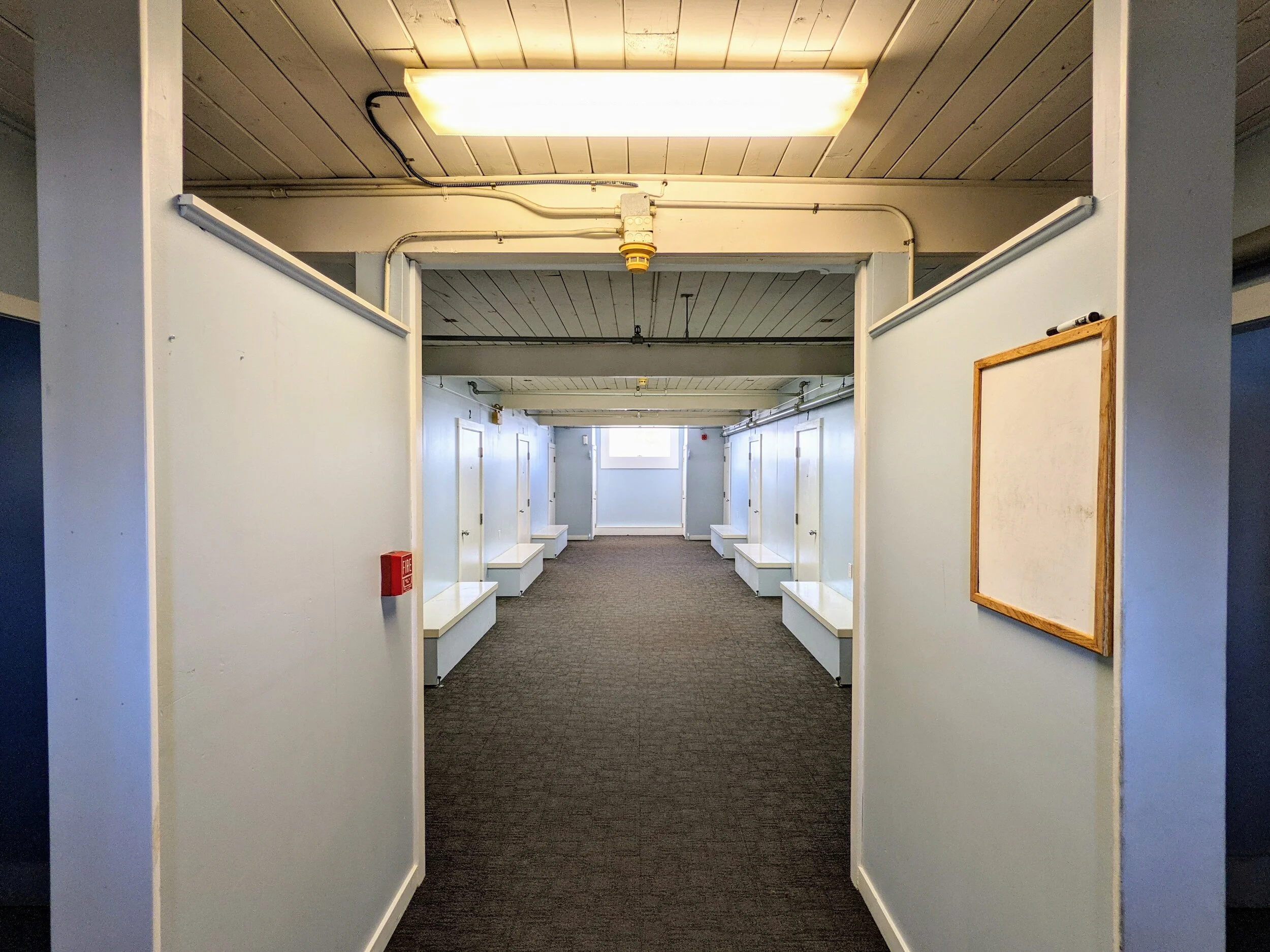 Hallway with bathrooms off to sides