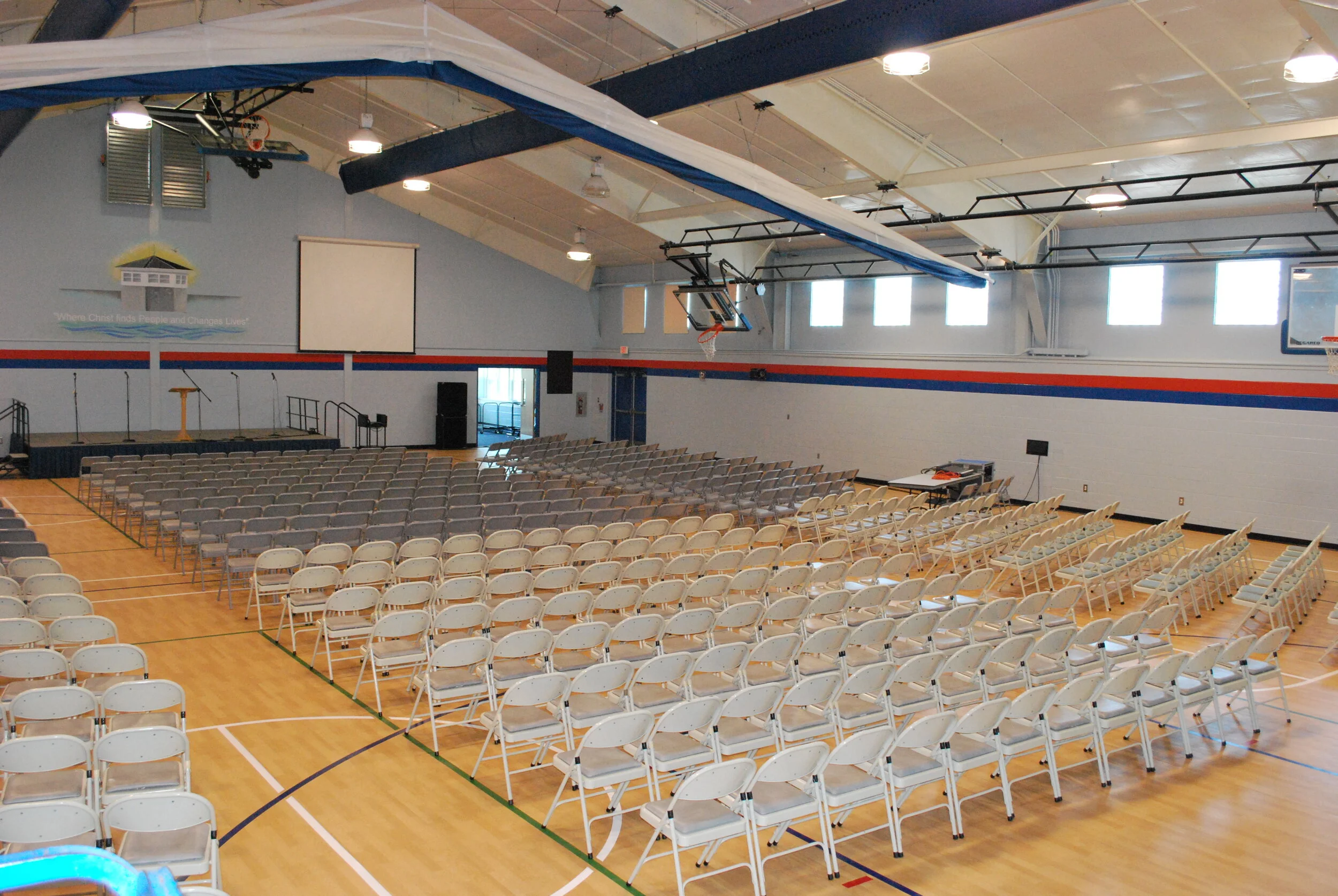 Gymnasium with chairs and stage