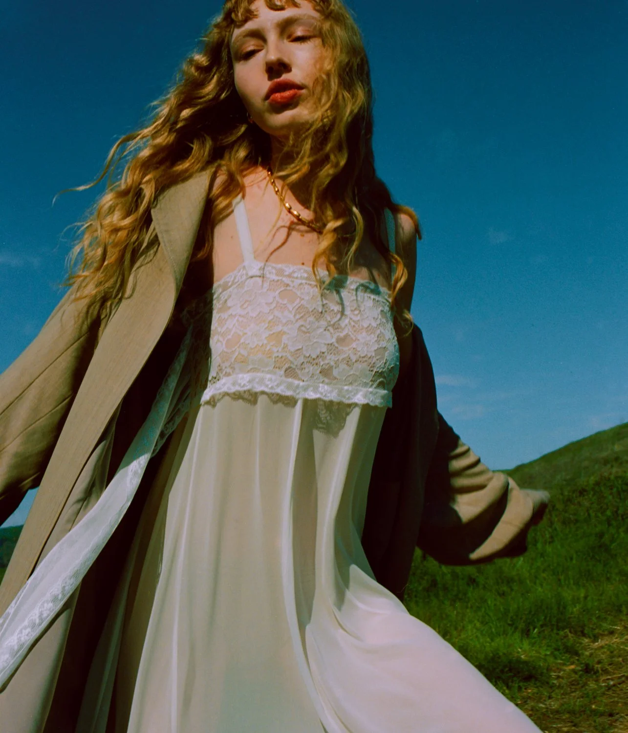 Loretta Caponi dress, Cult Gaia trench and PDPAOLA jewelry. 