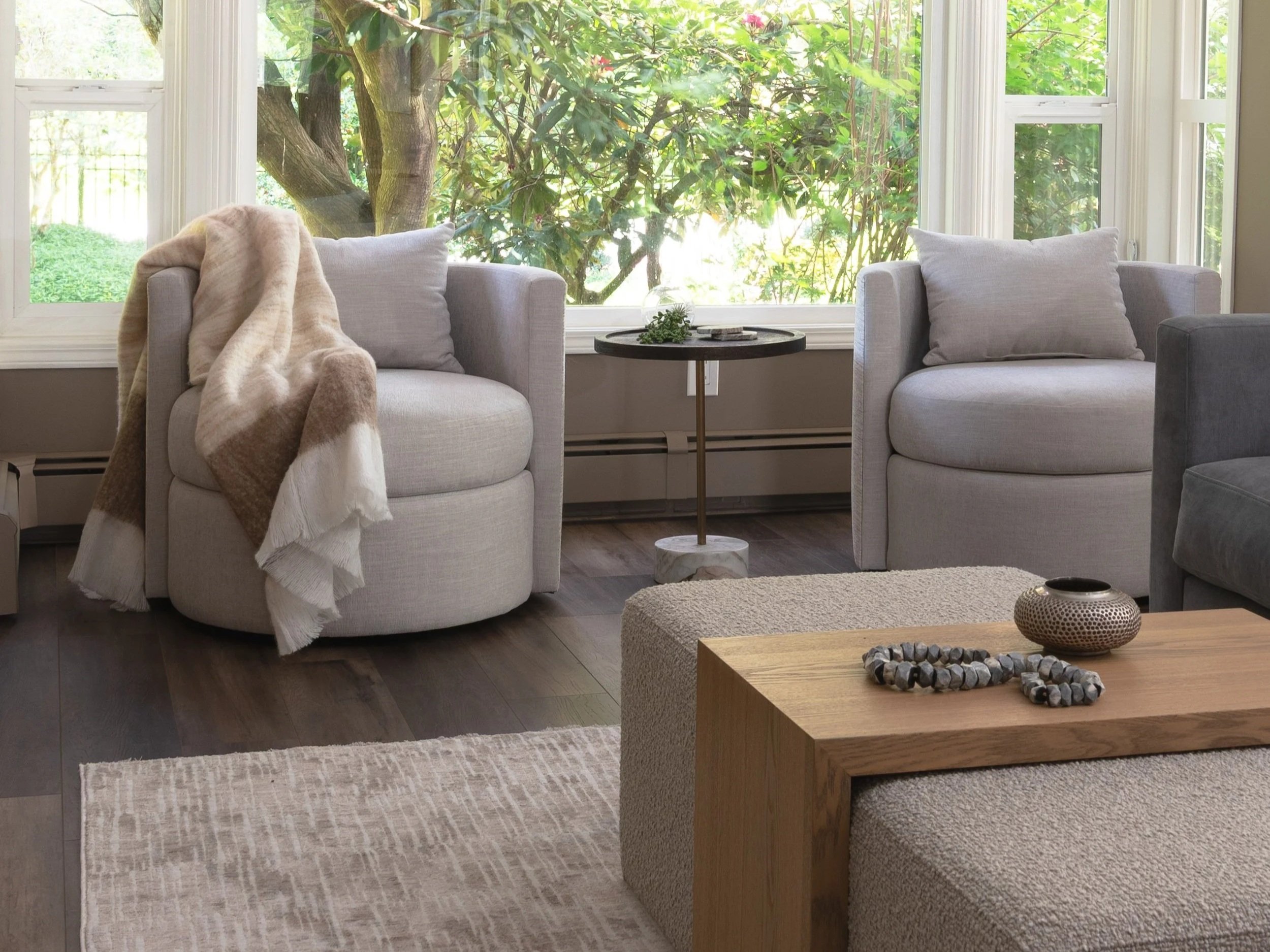 Modern swivel chairs as a pair in a warm coastal living room update