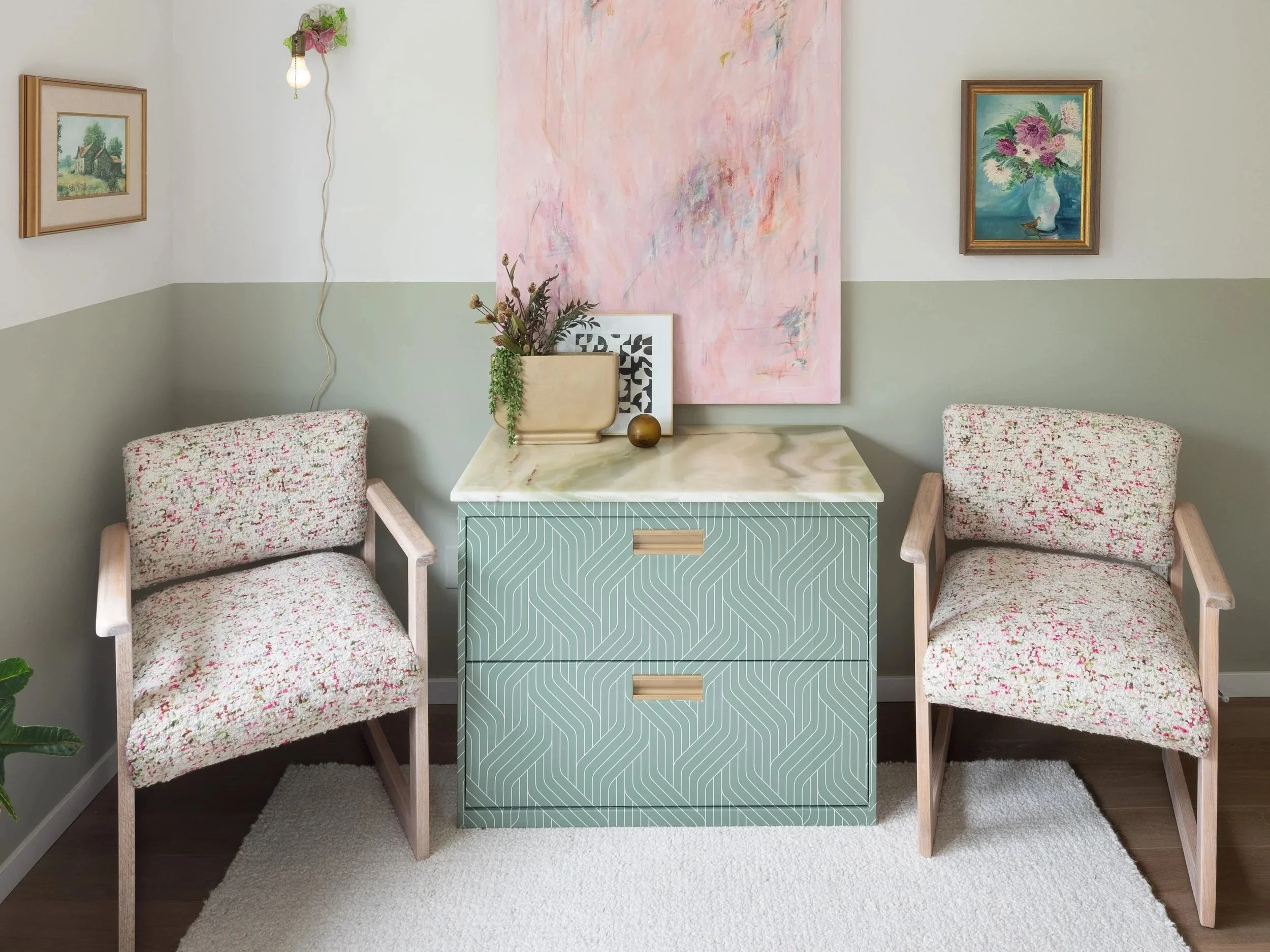 Updated office incorporates upcycled MCM oak office guest chairs reupholstered in a soft, feminine alpaca wool boucle luxury fabric designed to elevate the room by providing softness and elegance.