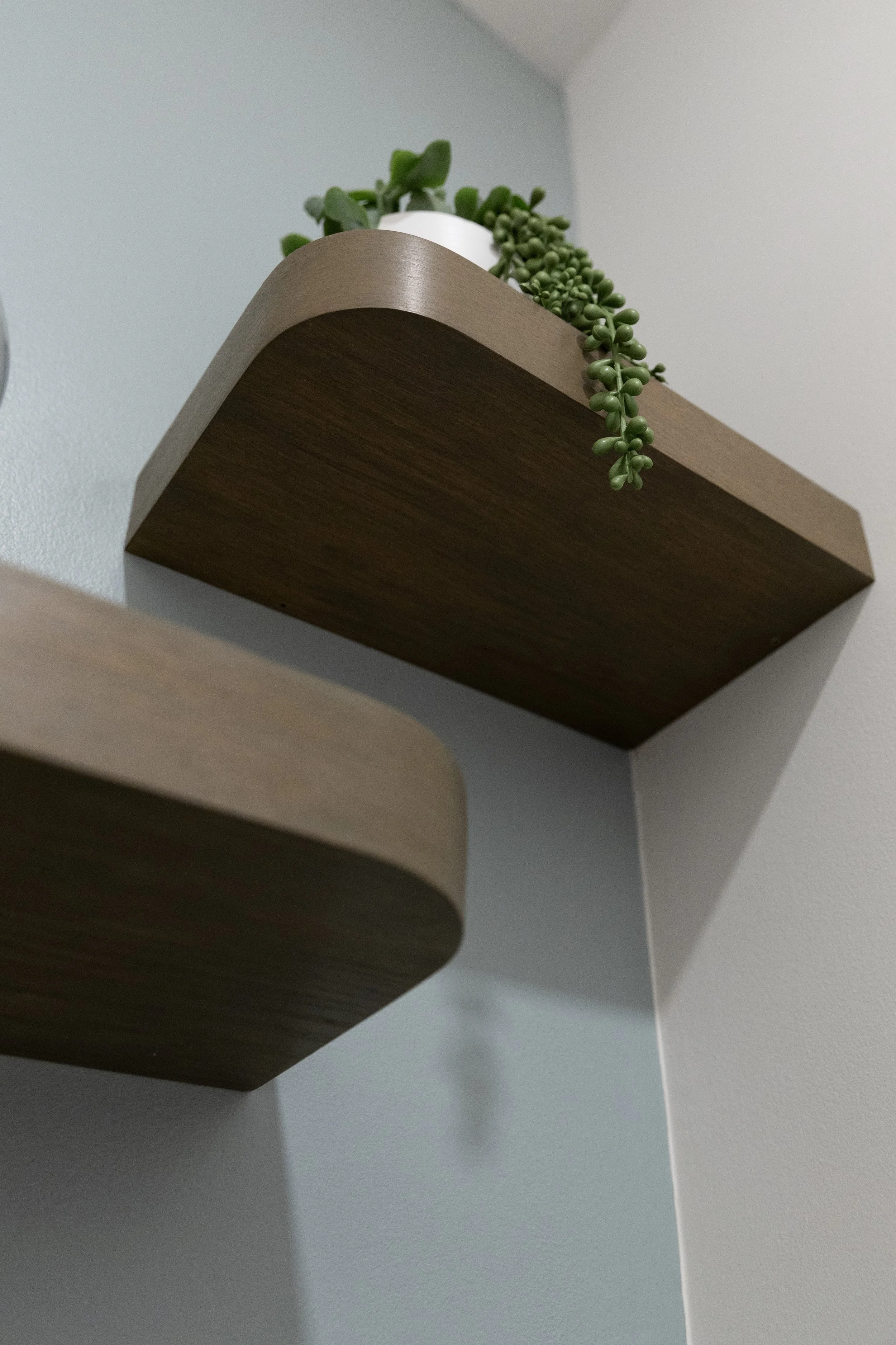 Custom designed bathroom shelving from North Vancouver, BC. Offset is height, the long shelf and short shelf overlap by about 2inches, but are spaced 8inches apart in height.