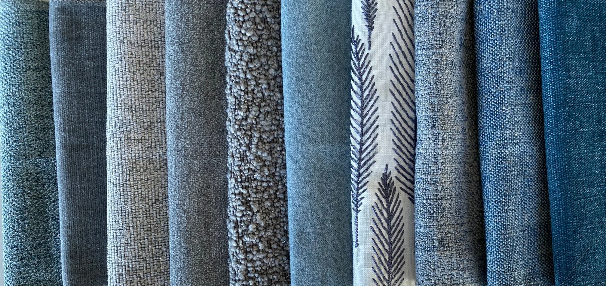 An assortment of blue fabrics
