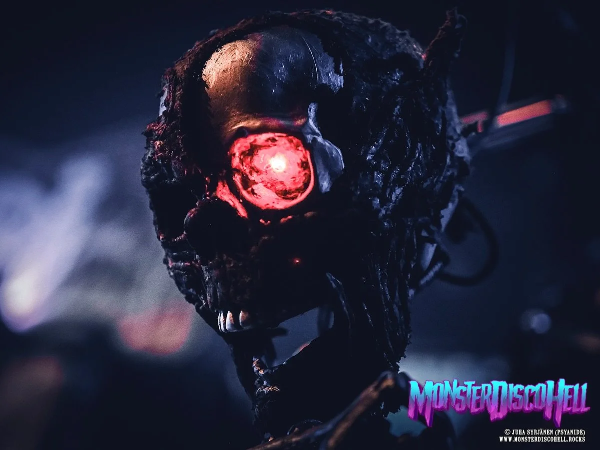 Happy Sunday, monstermaniacs! In today&rsquo;s Sunday Sundries, let&rsquo;s take a look at some of the stage props again. If you&rsquo;ve seen Lordi live these past few years, you&rsquo;ve probably seen this little guy hanging from the mic stand in f