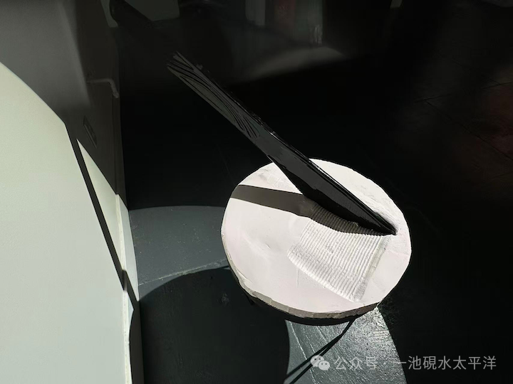 Giant plastic knife spreading cream cheese