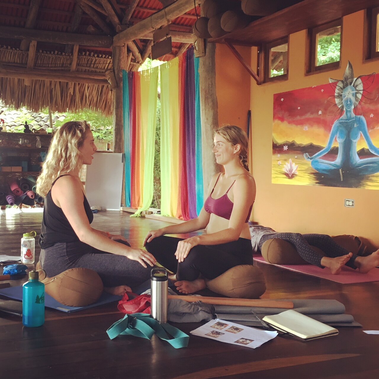 Two people sitting across from each other at peace