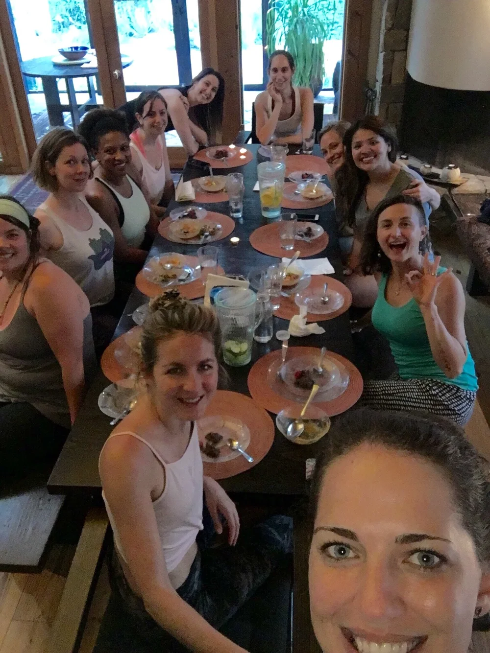 Retreat attendees smiling and sharing a meal