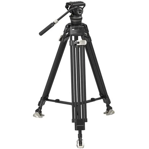 A tripod holding a camera, positioned for photography or videography.
